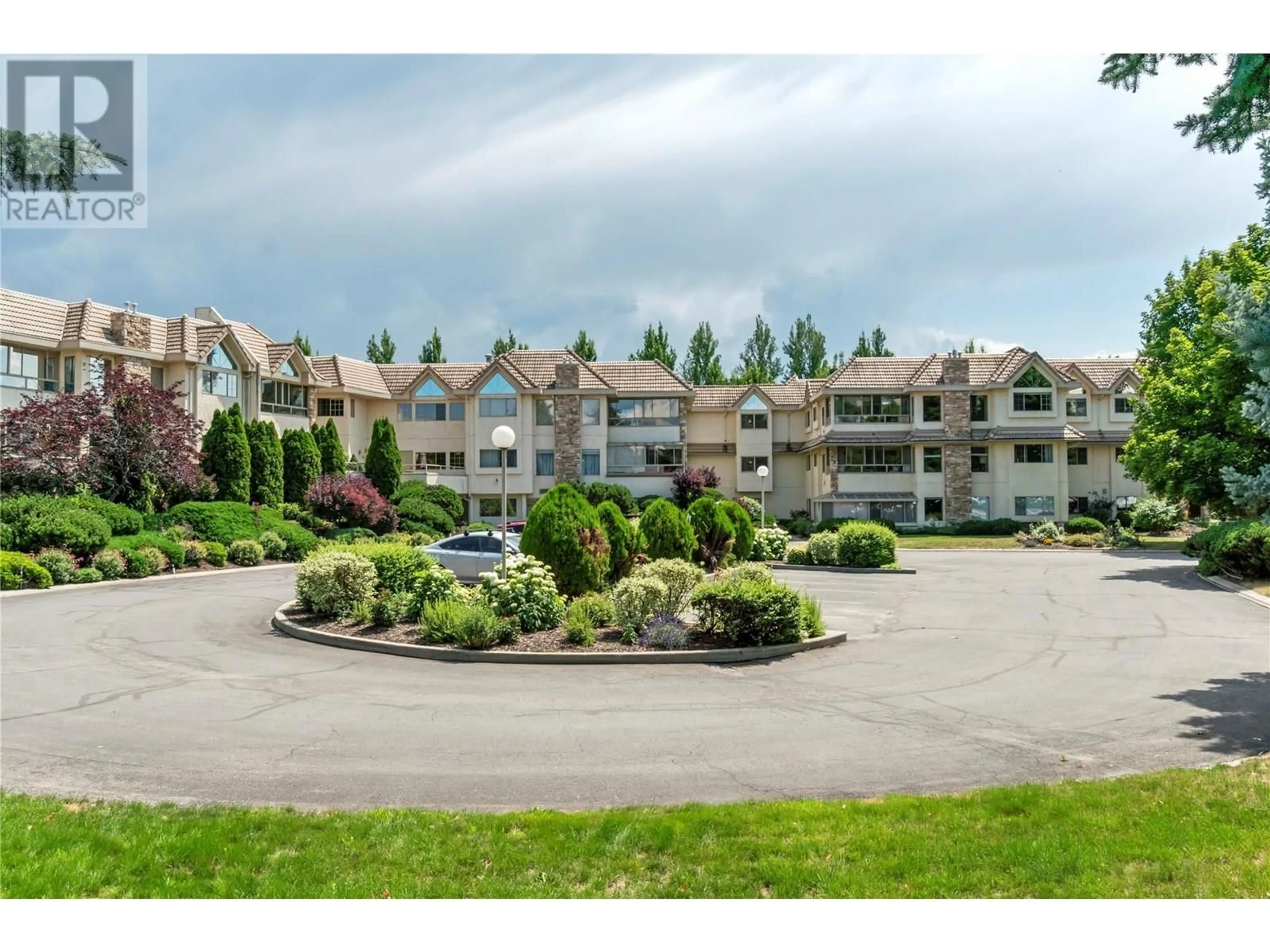 A pic from outside/outdoor area/front of a property/back of a property/a pic from drone, mountain view for 308 - 3335 RICHTER STREET, Kelowna British Columbia V1W3Y1