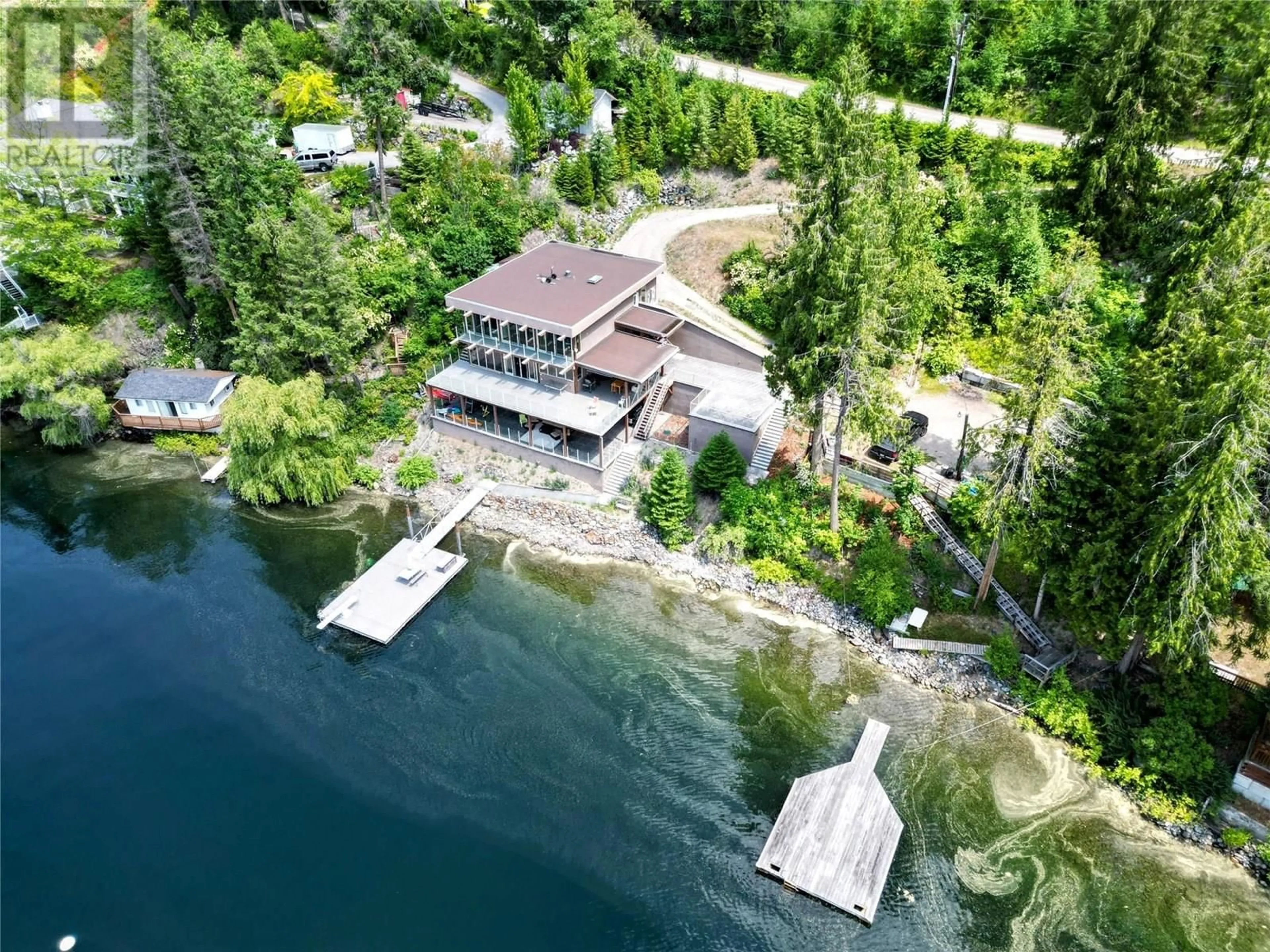 A pic from outside/outdoor area/front of a property/back of a property/a pic from drone, water/lake/river/ocean view for 2411 SUNSET DRIVE, Christina Lake British Columbia V0H1E2