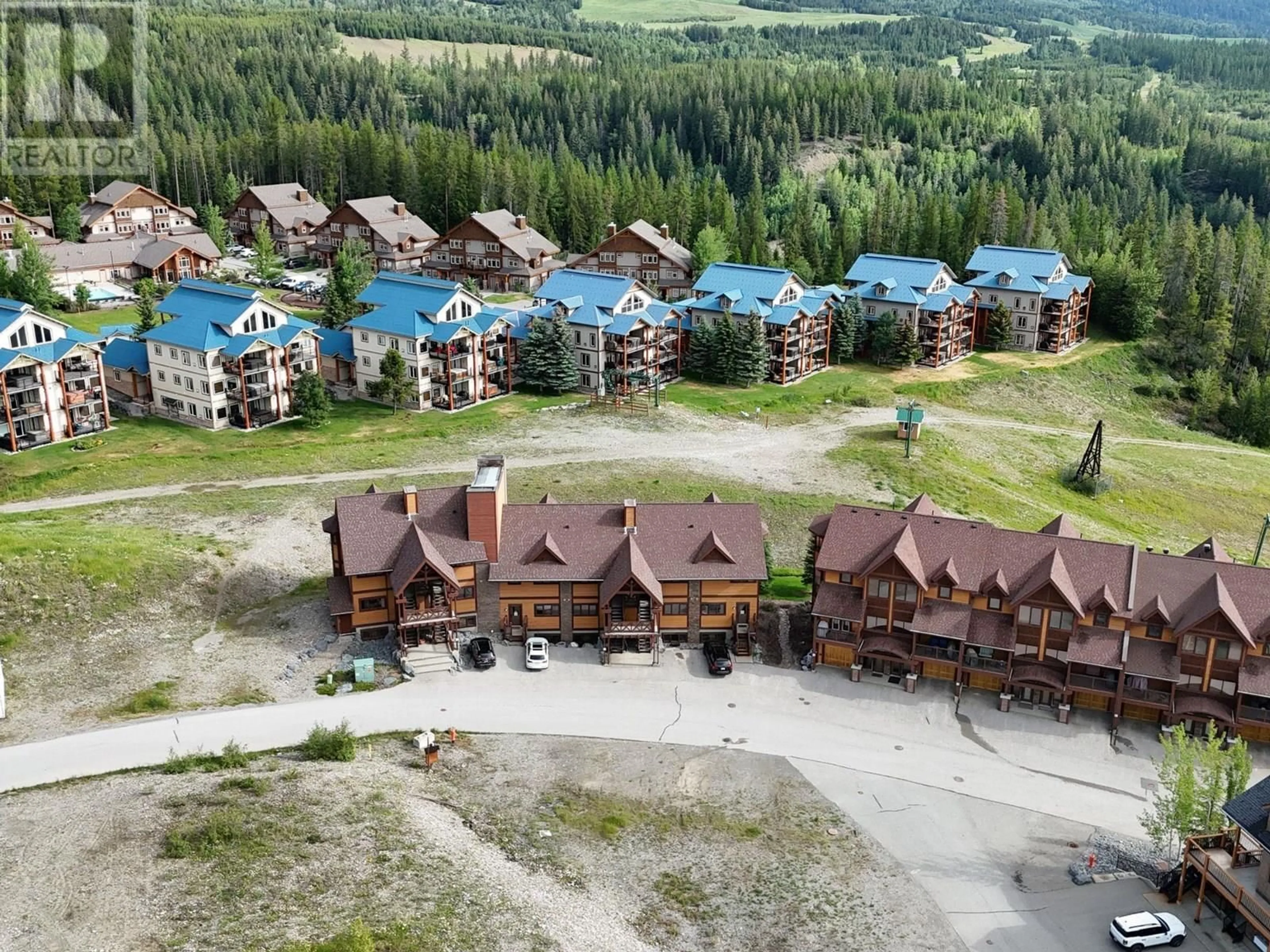 A pic from outside/outdoor area/front of a property/back of a property/a pic from drone, mountain view for 9 - 1301 GERRY SORENSEN WAY, Kimberley British Columbia V1A2Y4