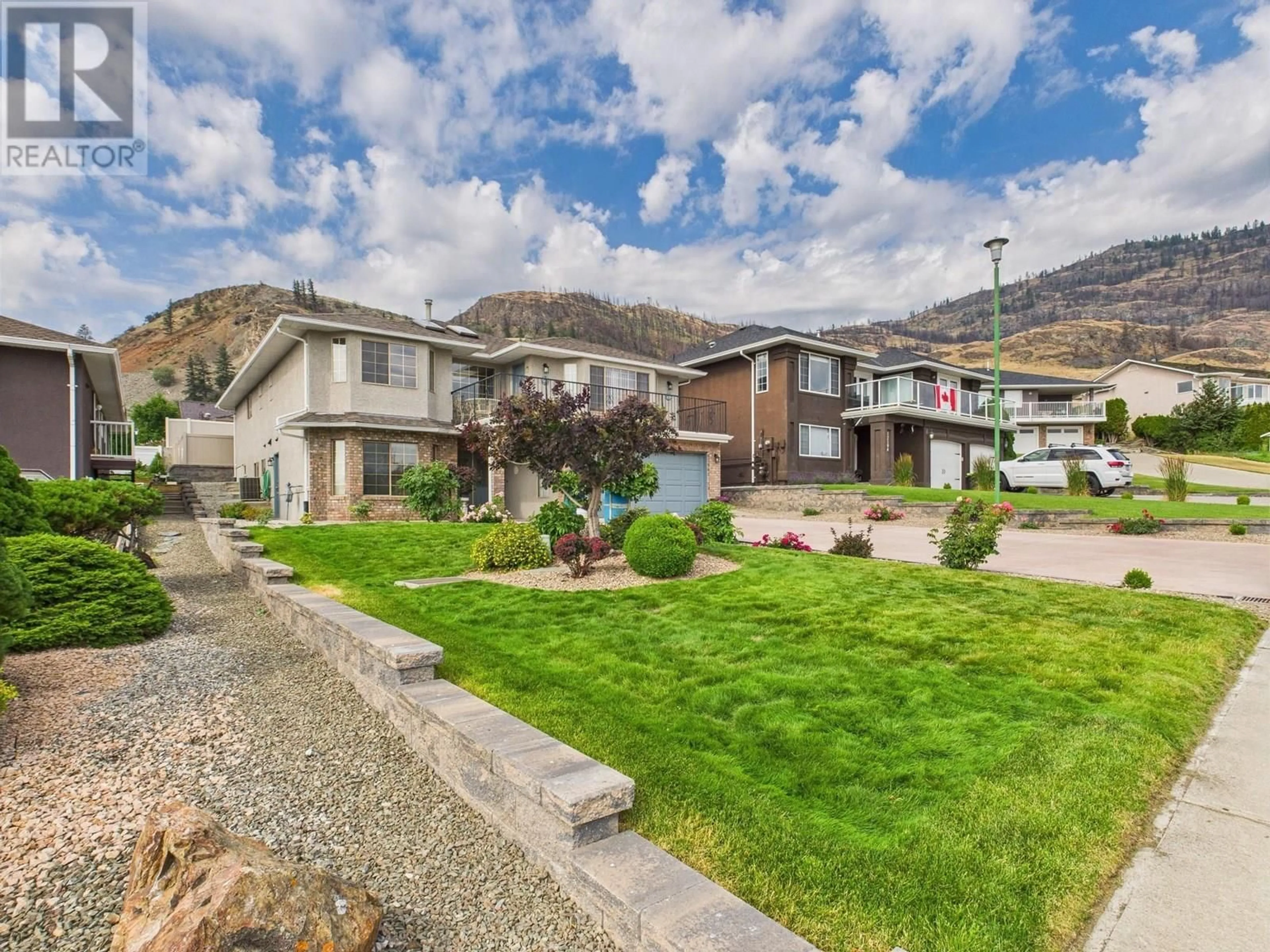 A pic from outside/outdoor area/front of a property/back of a property/a pic from drone, mountain view for 12102 GOLF COURSE DRIVE, Osoyoos British Columbia V0H1V4