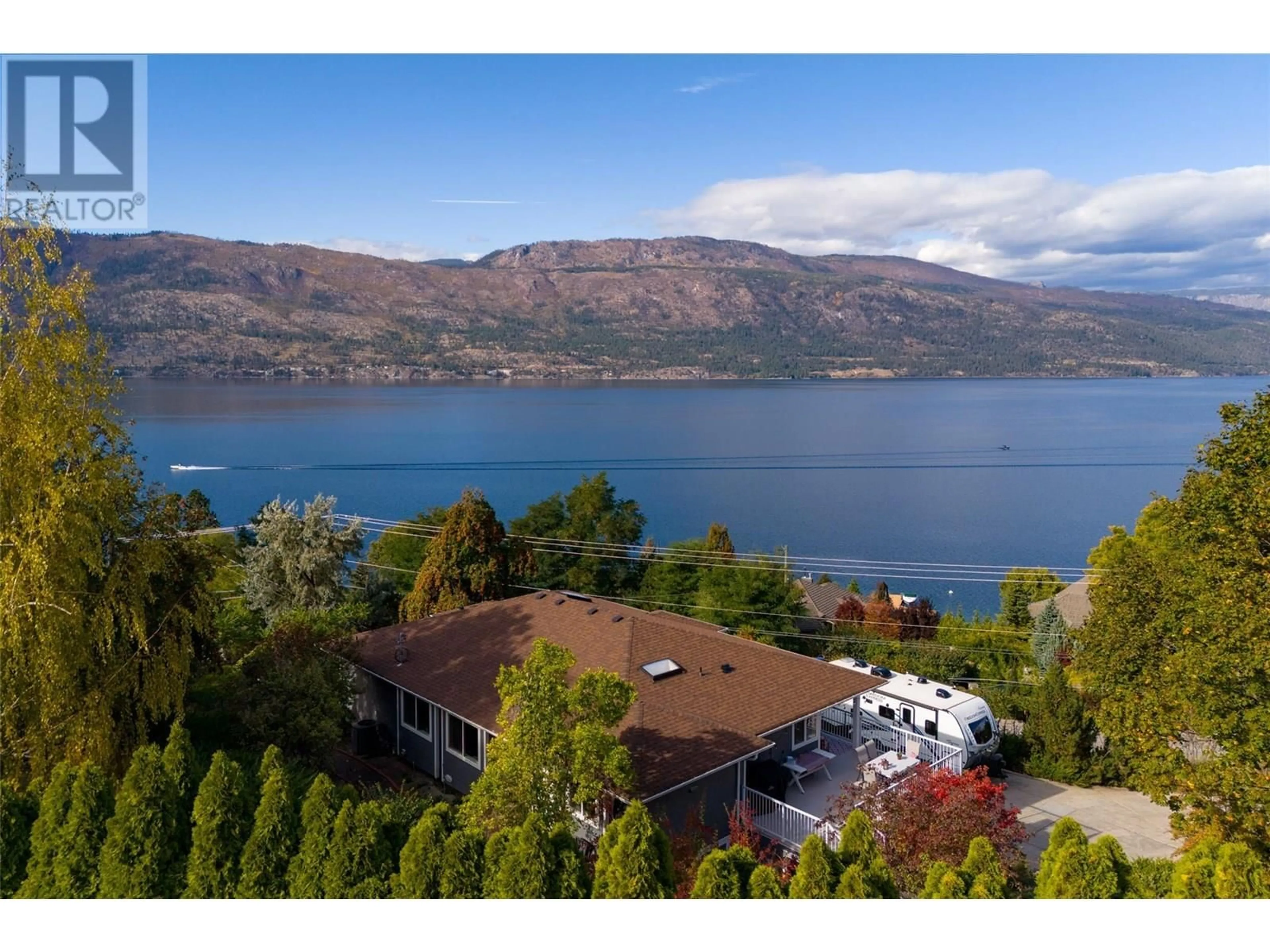A pic from outside/outdoor area/front of a property/back of a property/a pic from drone, water/lake/river/ocean view for 11935 OKANAGAN CENTRE ROAD WEST, Lake Country British Columbia V4V2H5