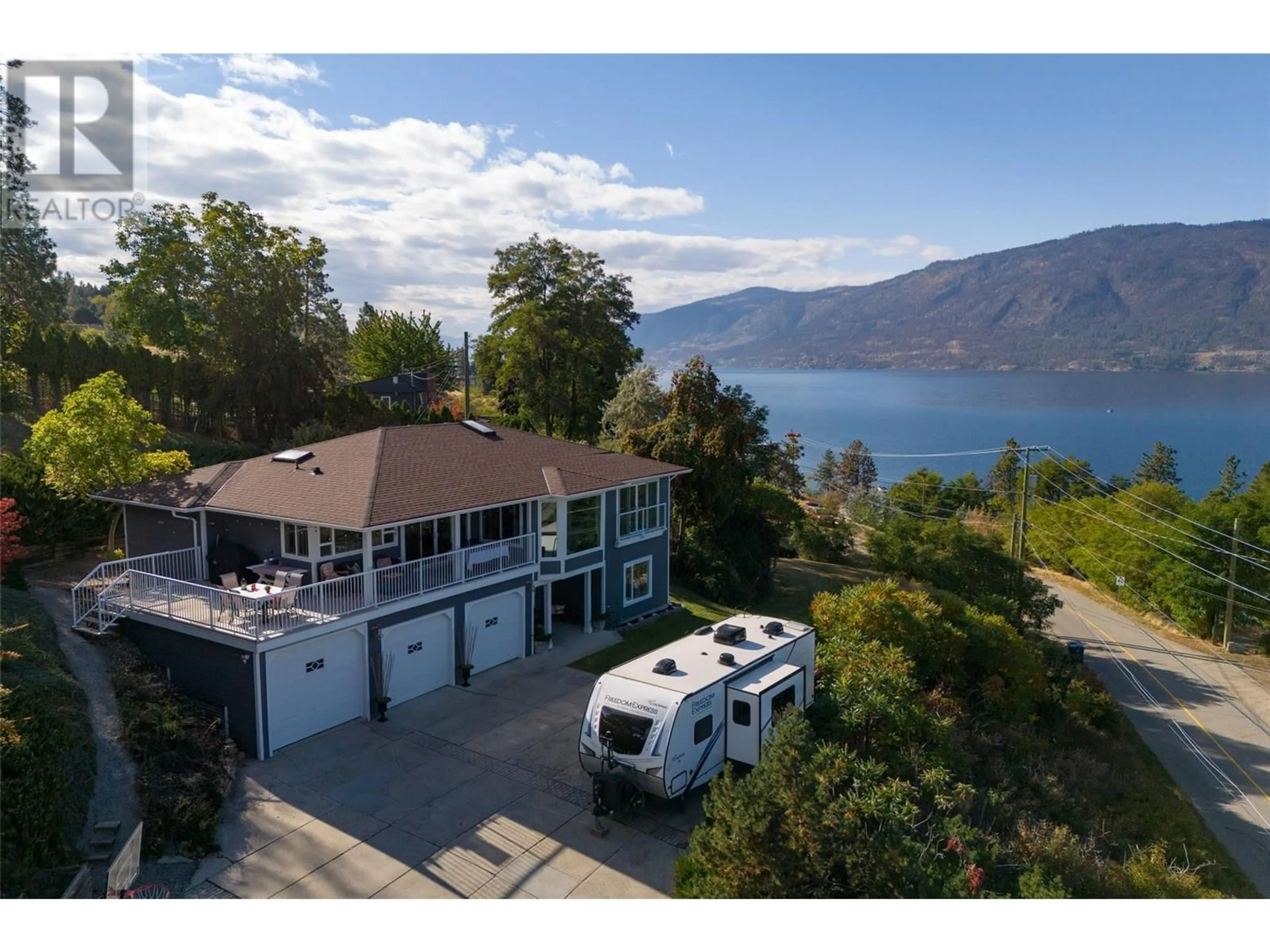 A pic from outside/outdoor area/front of a property/back of a property/a pic from drone, water/lake/river/ocean view for 11935 OKANAGAN CENTRE ROAD WEST, Lake Country British Columbia V4V2H5