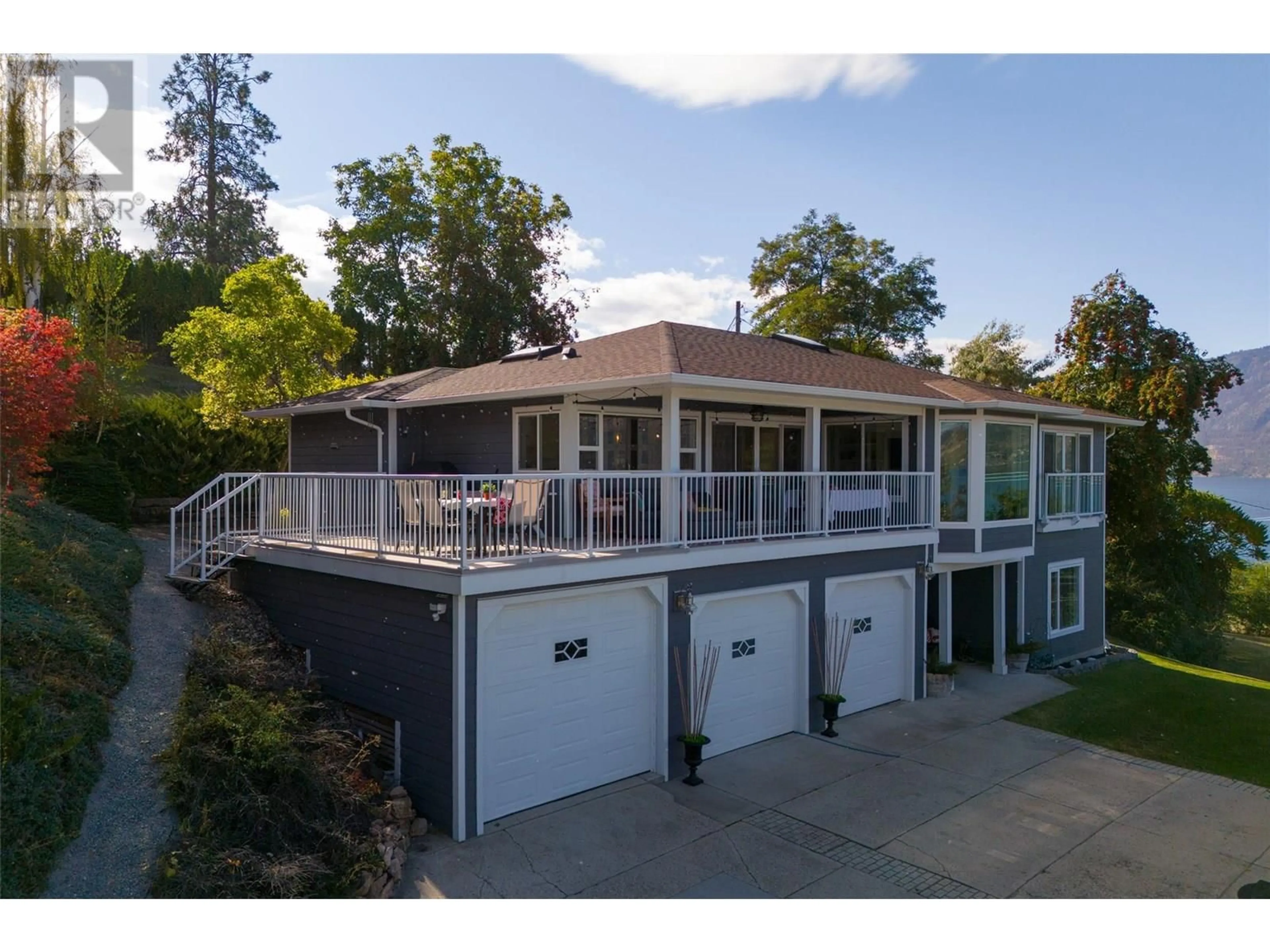 A pic from outside/outdoor area/front of a property/back of a property/a pic from drone, water/lake/river/ocean view for 11935 OKANAGAN CENTRE ROAD WEST, Lake Country British Columbia V4V2H5
