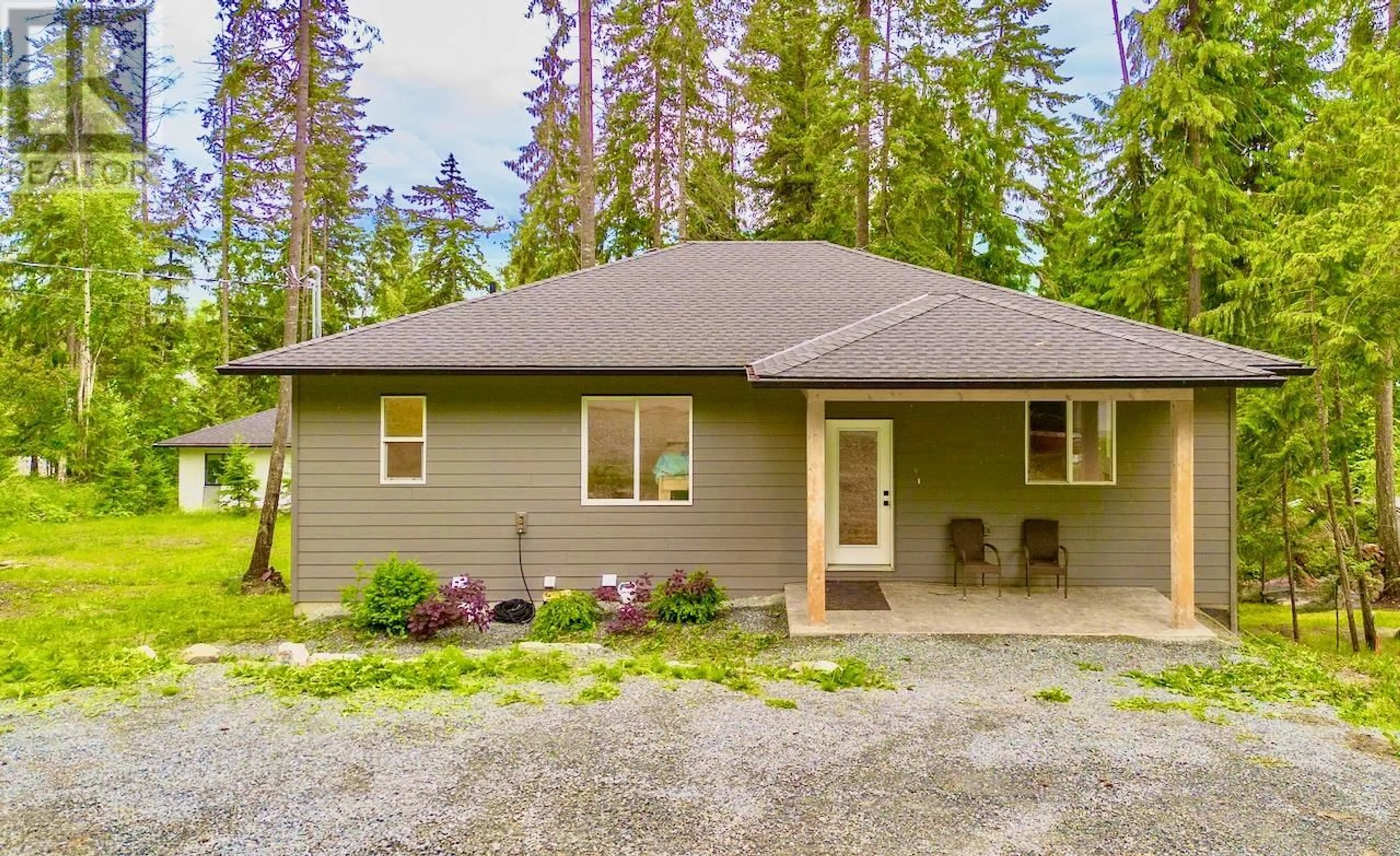 Home with vinyl exterior material, street for 7468 ESTATE DRIVE, Anglemont British Columbia V0E1M8