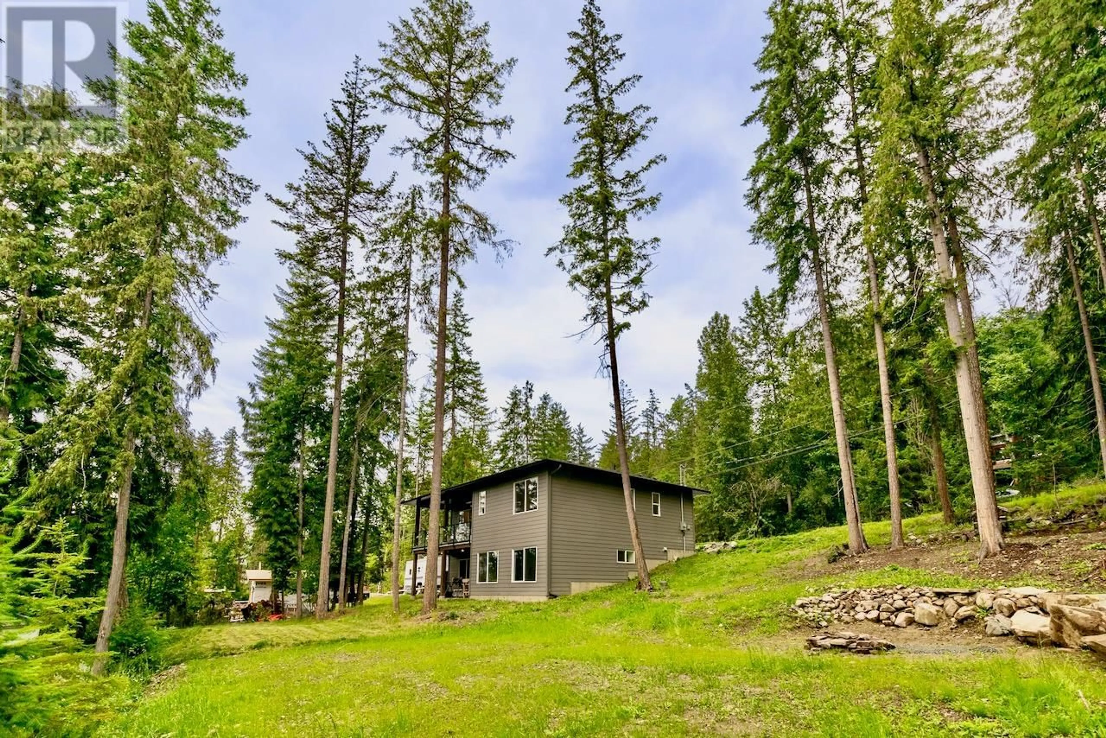 A pic from outside/outdoor area/front of a property/back of a property/a pic from drone, forest/trees view for 7468 ESTATE DRIVE, Anglemont British Columbia V0E1M8