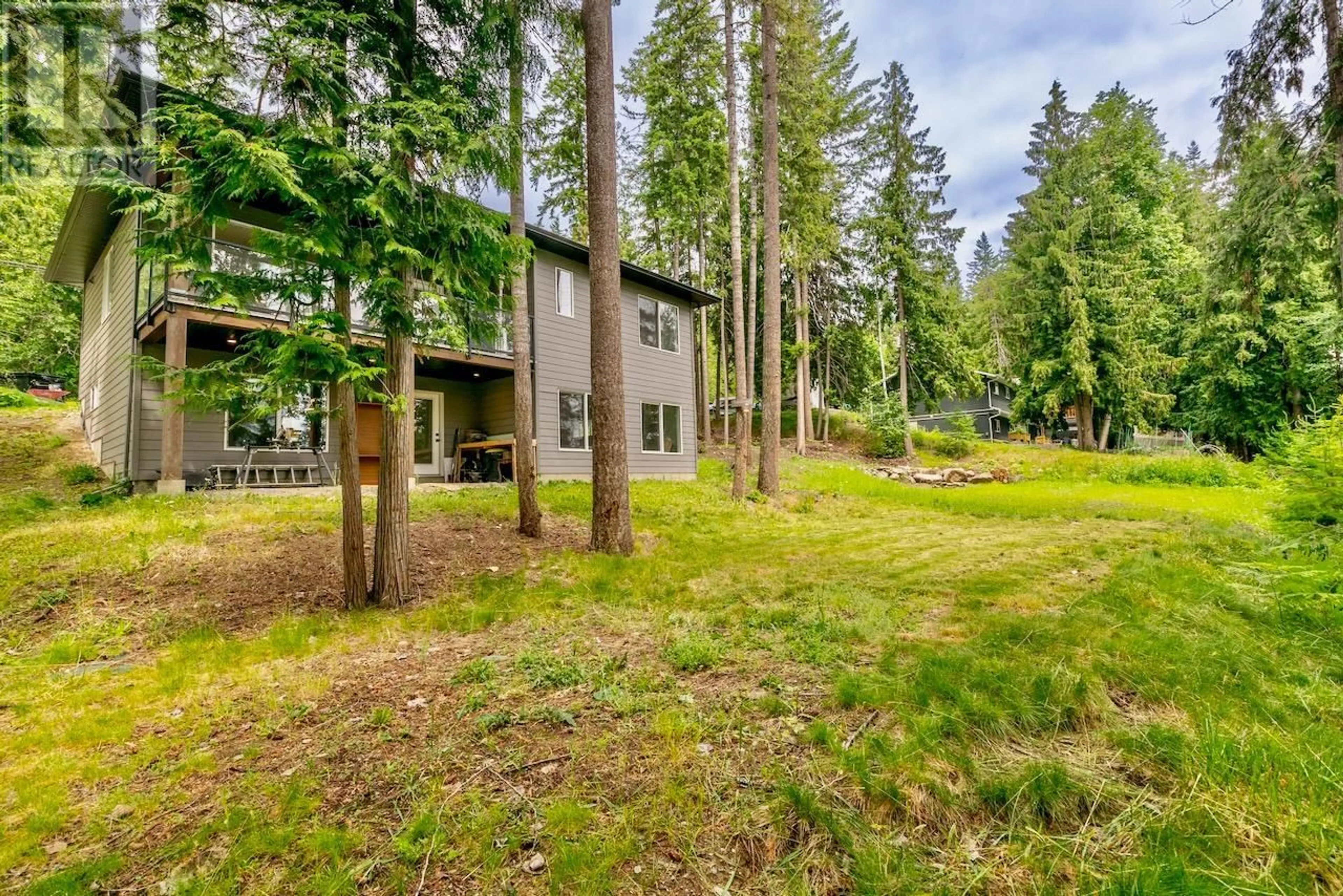 A pic from outside/outdoor area/front of a property/back of a property/a pic from drone, forest/trees view for 7468 ESTATE DRIVE, Anglemont British Columbia V0E1M8