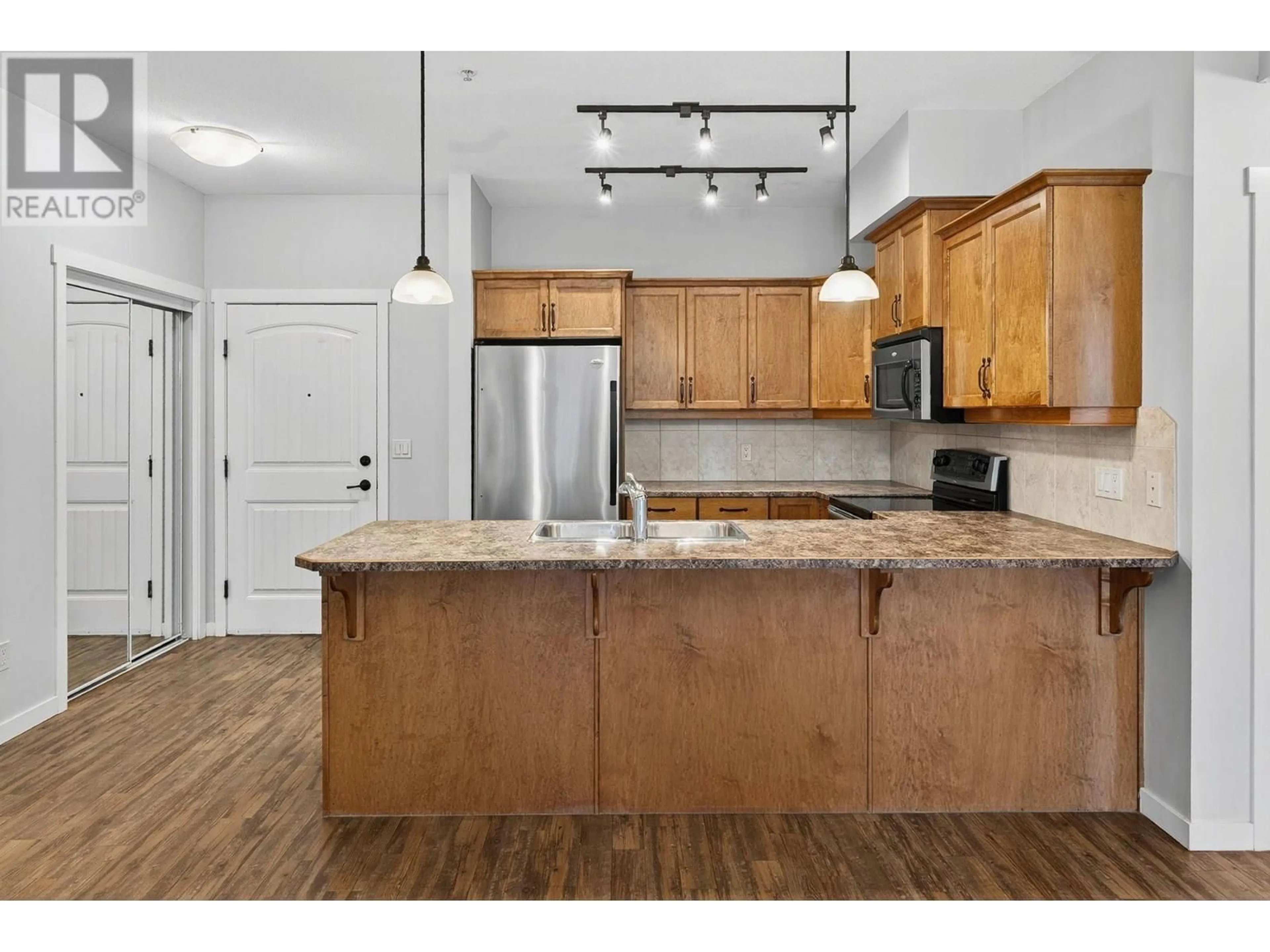 Open concept kitchen, unknown for 210 - 3739 CASORSO ROAD, Kelowna British Columbia V1W5E8