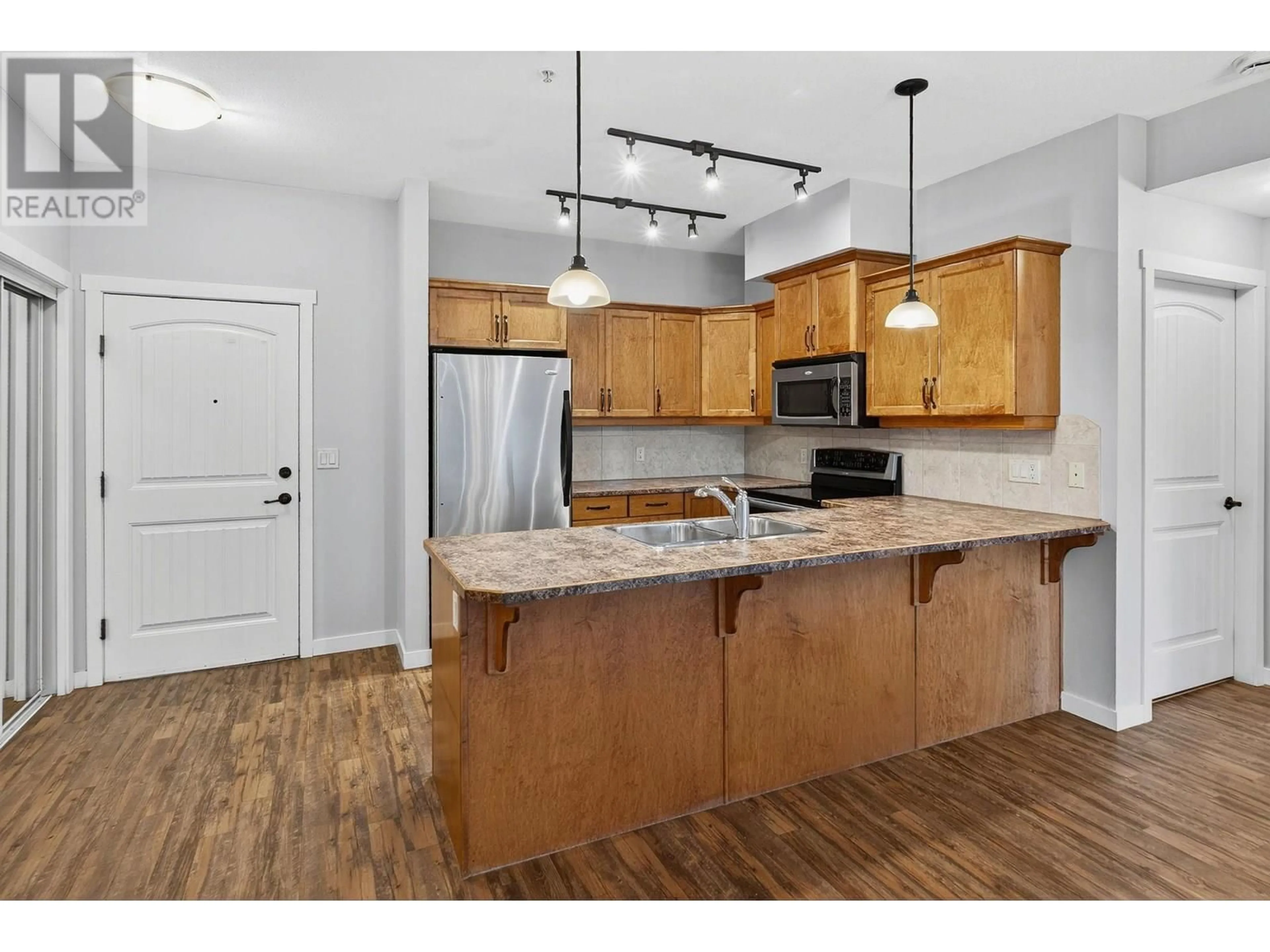 Open concept kitchen, unknown for 210 - 3739 CASORSO ROAD, Kelowna British Columbia V1W5E8