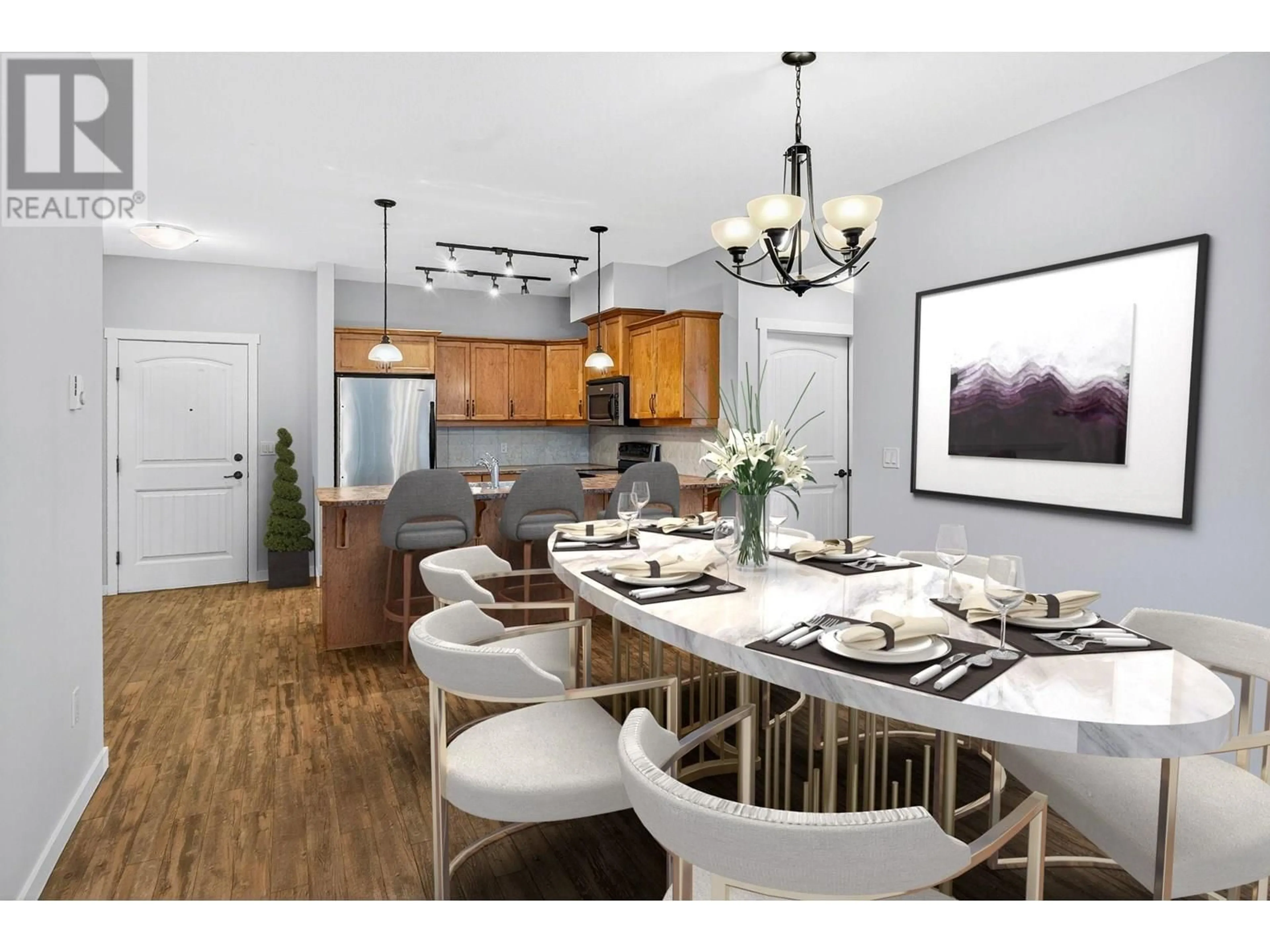 Open concept kitchen, wood/laminate floor for 210 - 3739 CASORSO ROAD, Kelowna British Columbia V1W5E8