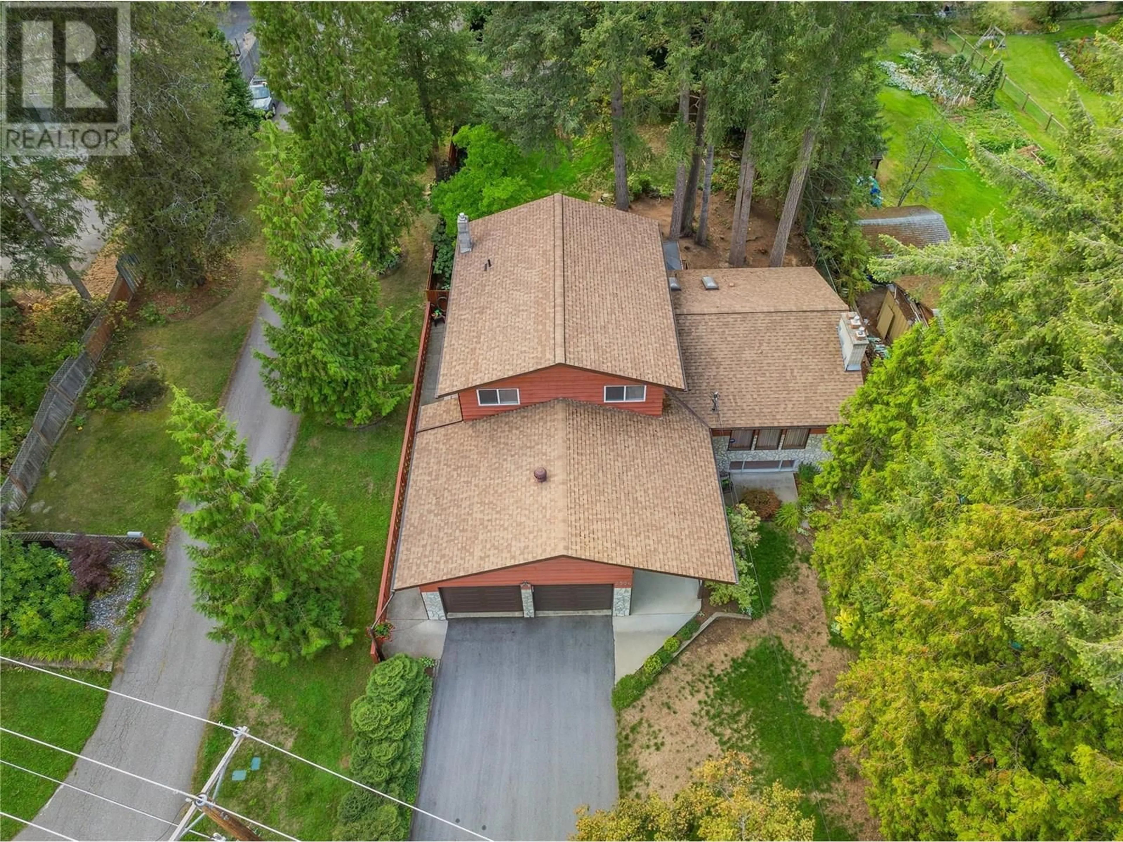 A pic from outside/outdoor area/front of a property/back of a property/a pic from drone, forest/trees view for 2504 14TH AVENUE, Castlegar British Columbia V1N3P1