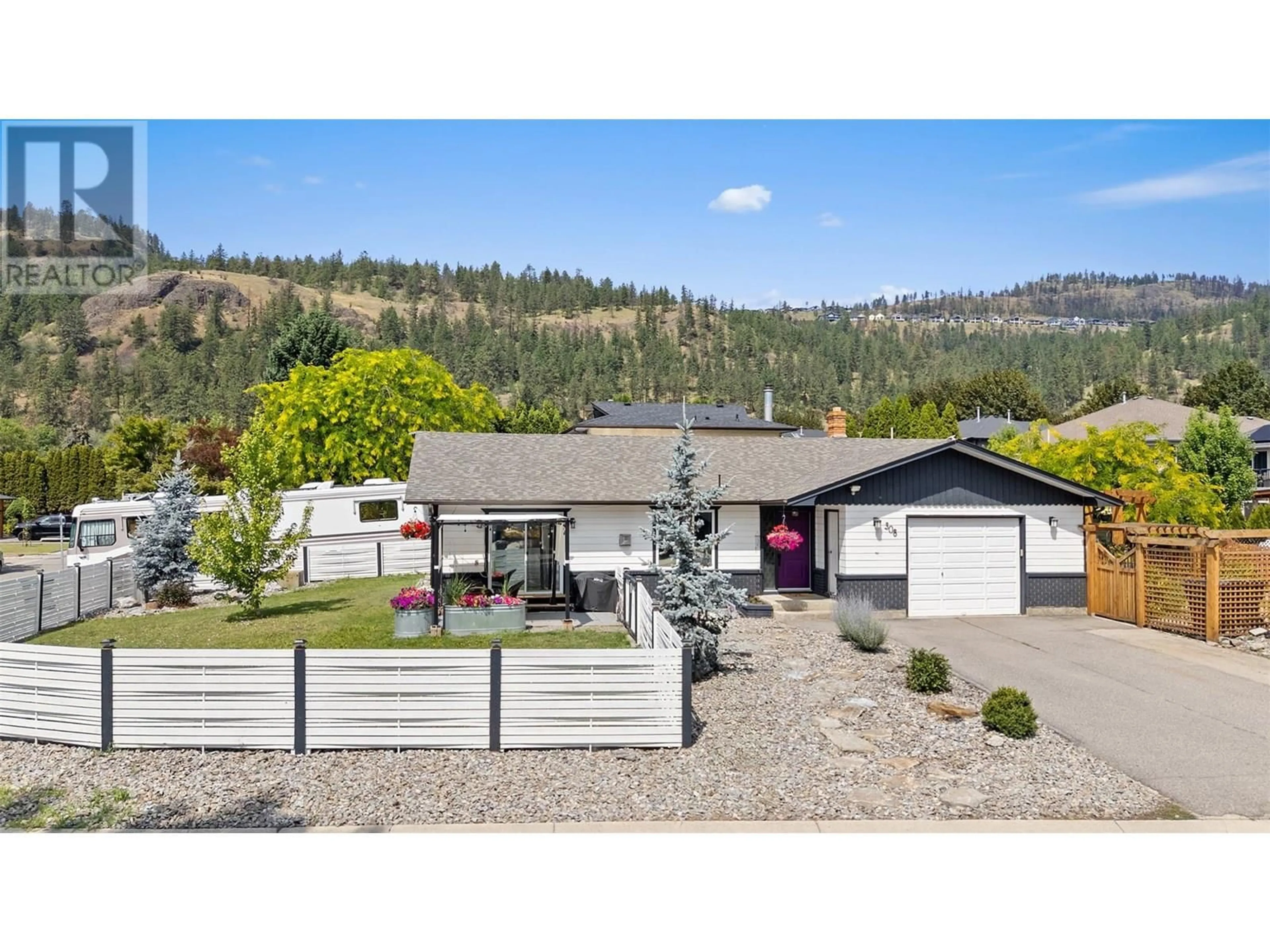 A pic from outside/outdoor area/front of a property/back of a property/a pic from drone, mountain view for 308 MCTAVISH ROAD, Kelowna British Columbia V1V1P2