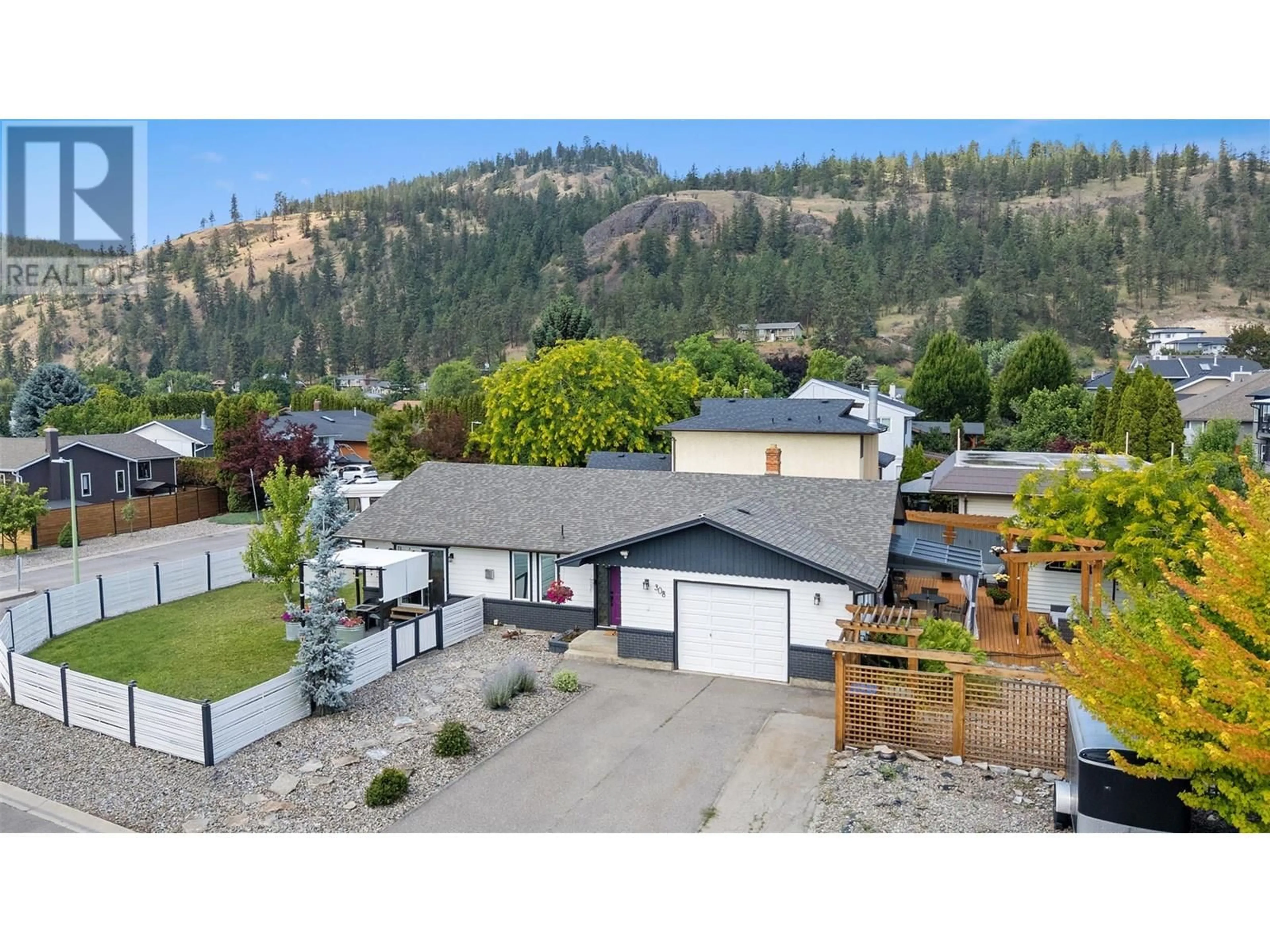 A pic from outside/outdoor area/front of a property/back of a property/a pic from drone, mountain view for 308 MCTAVISH ROAD, Kelowna British Columbia V1V1P2