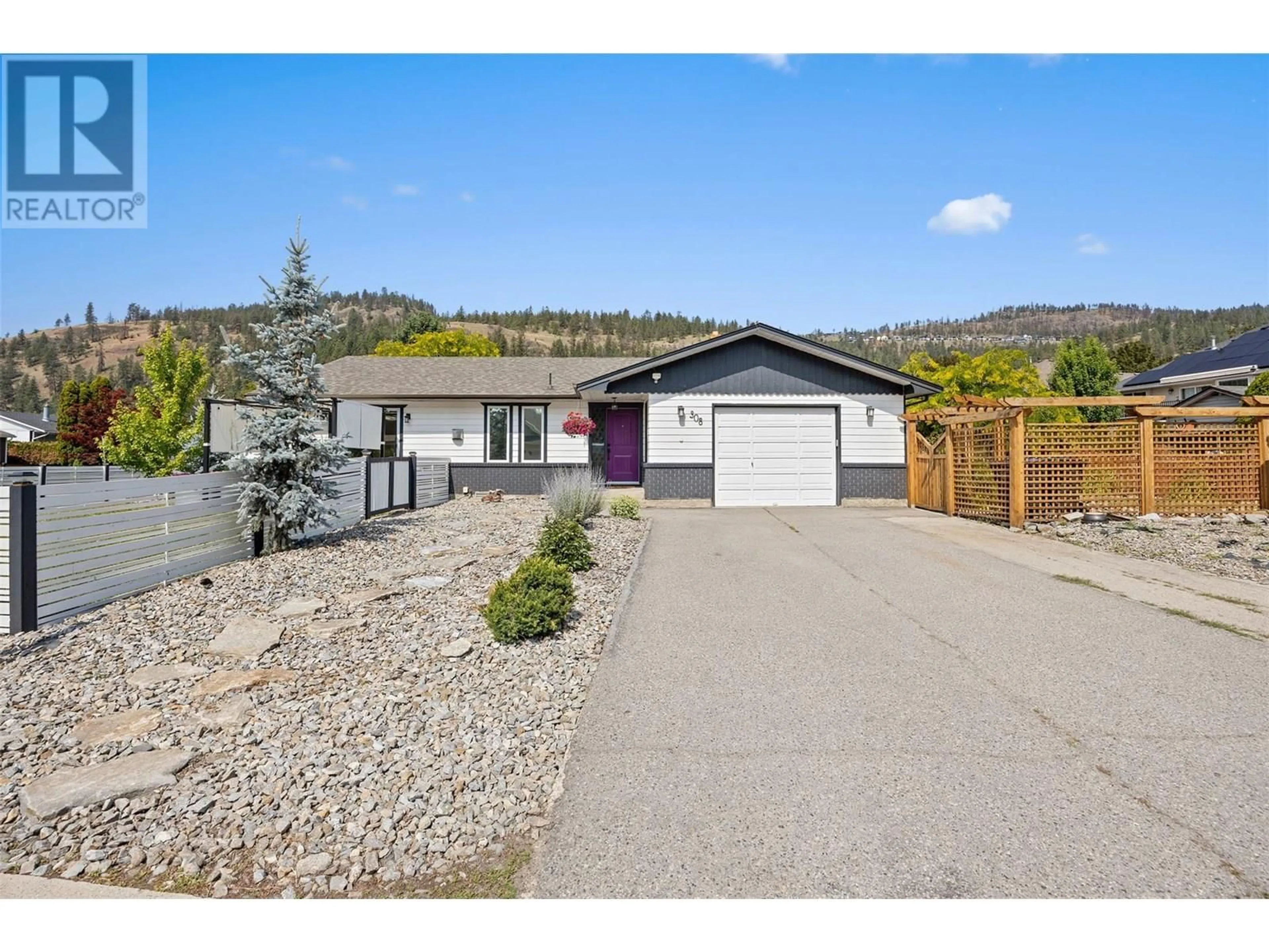 A pic from outside/outdoor area/front of a property/back of a property/a pic from drone, street for 308 MCTAVISH ROAD, Kelowna British Columbia V1V1P2