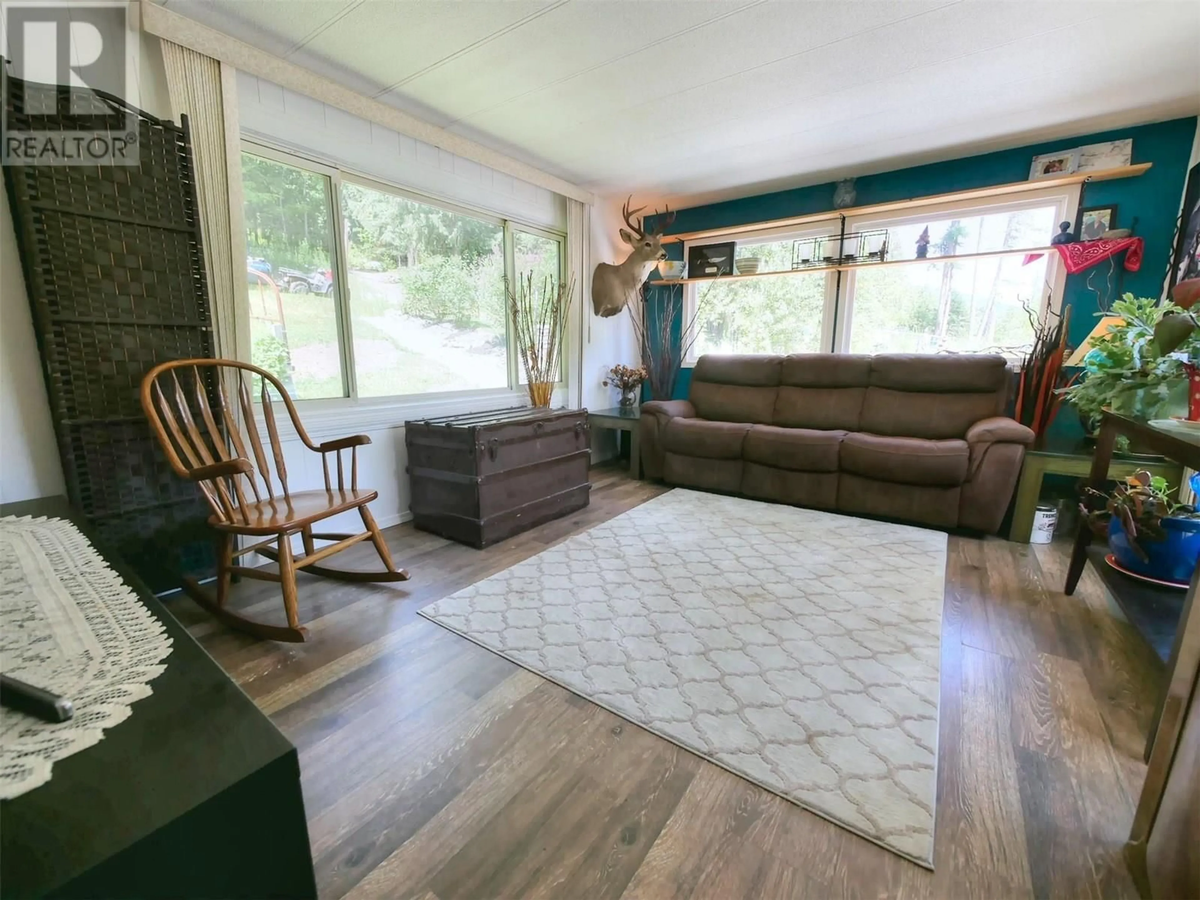Living room with furniture, wood/laminate floor for 1137 36TH AVENUE NORTH, Creston British Columbia V0B1G1