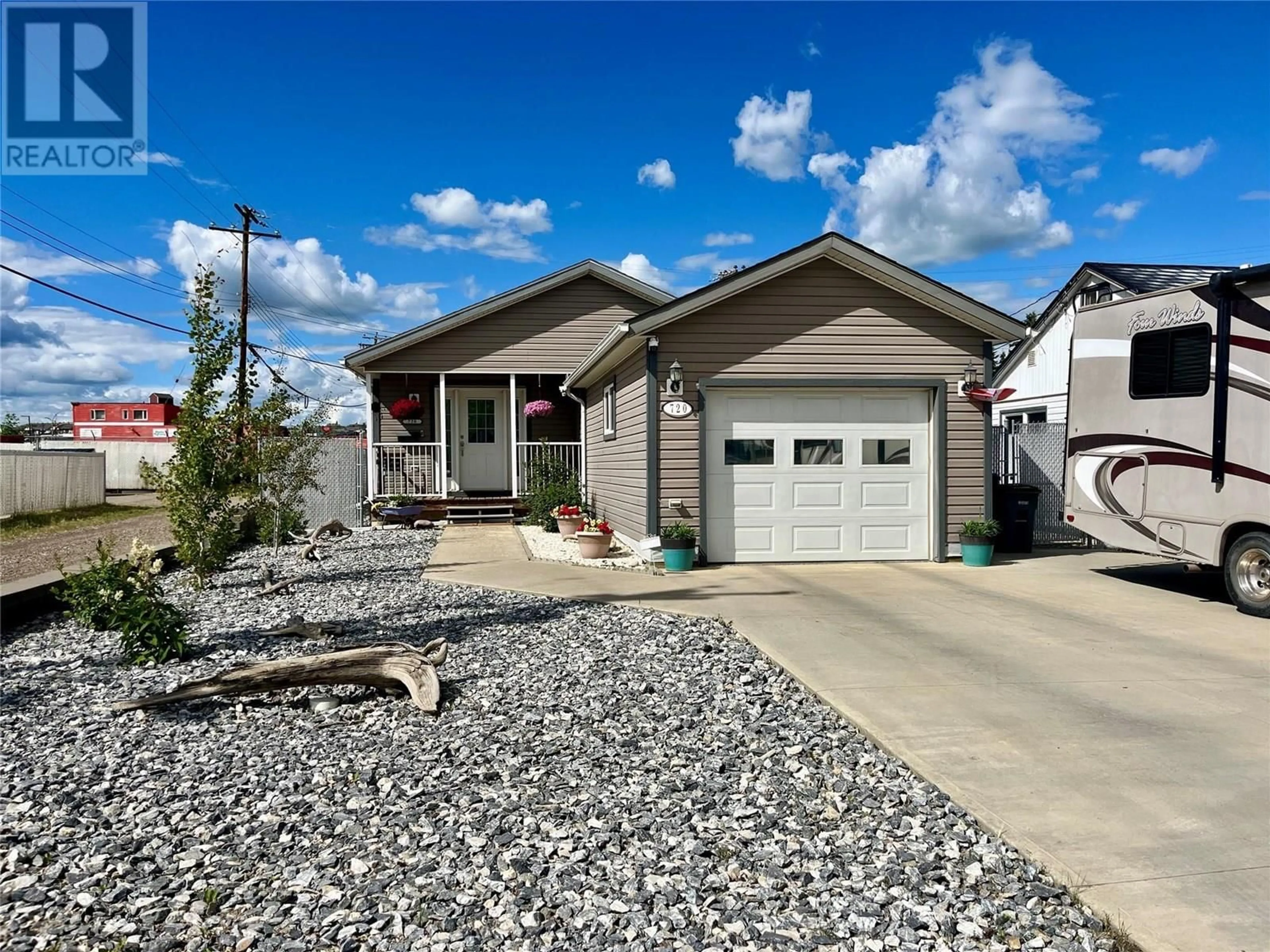 Home with vinyl exterior material, street for 720 105 AVENUE, Dawson Creek British Columbia V1G2K6