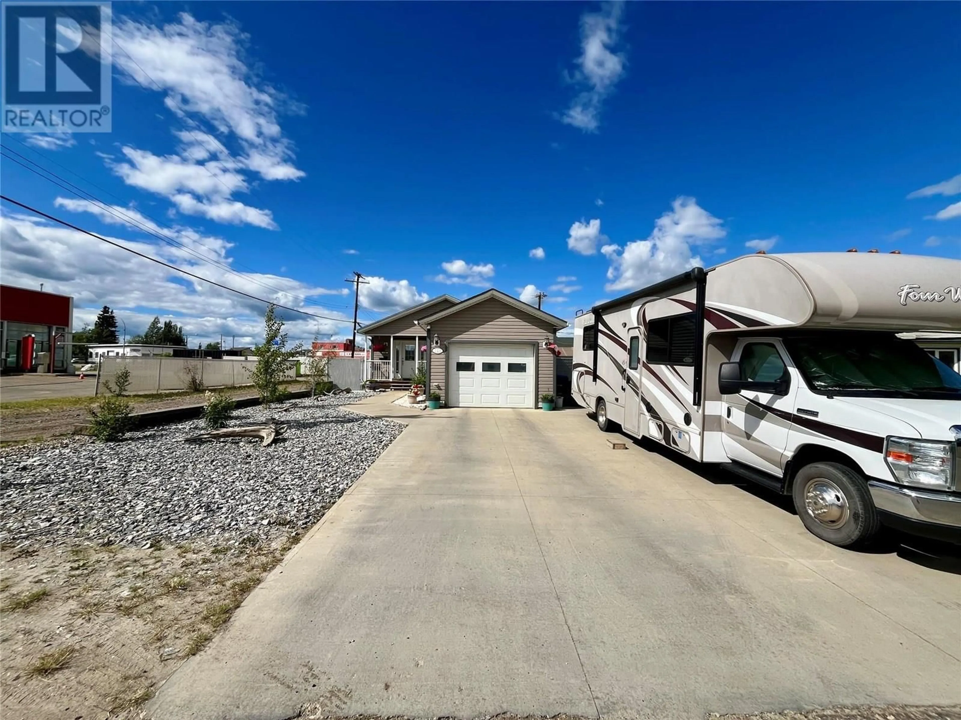 A pic from outside/outdoor area/front of a property/back of a property/a pic from drone, street for 720 105 AVENUE, Dawson Creek British Columbia V1G2K6