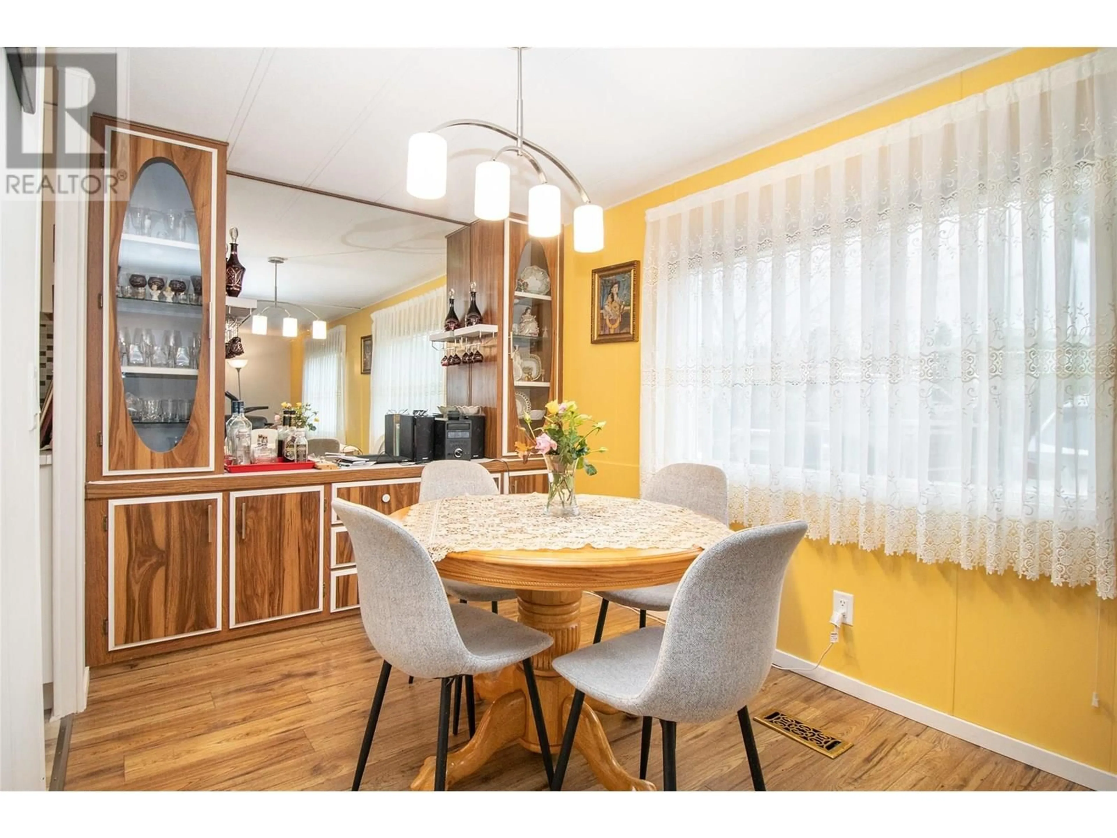 Dining room, wood/laminate floor for 141 - 1880 OLD BOUCHERIE ROAD, West Kelowna British Columbia V4T1Z3