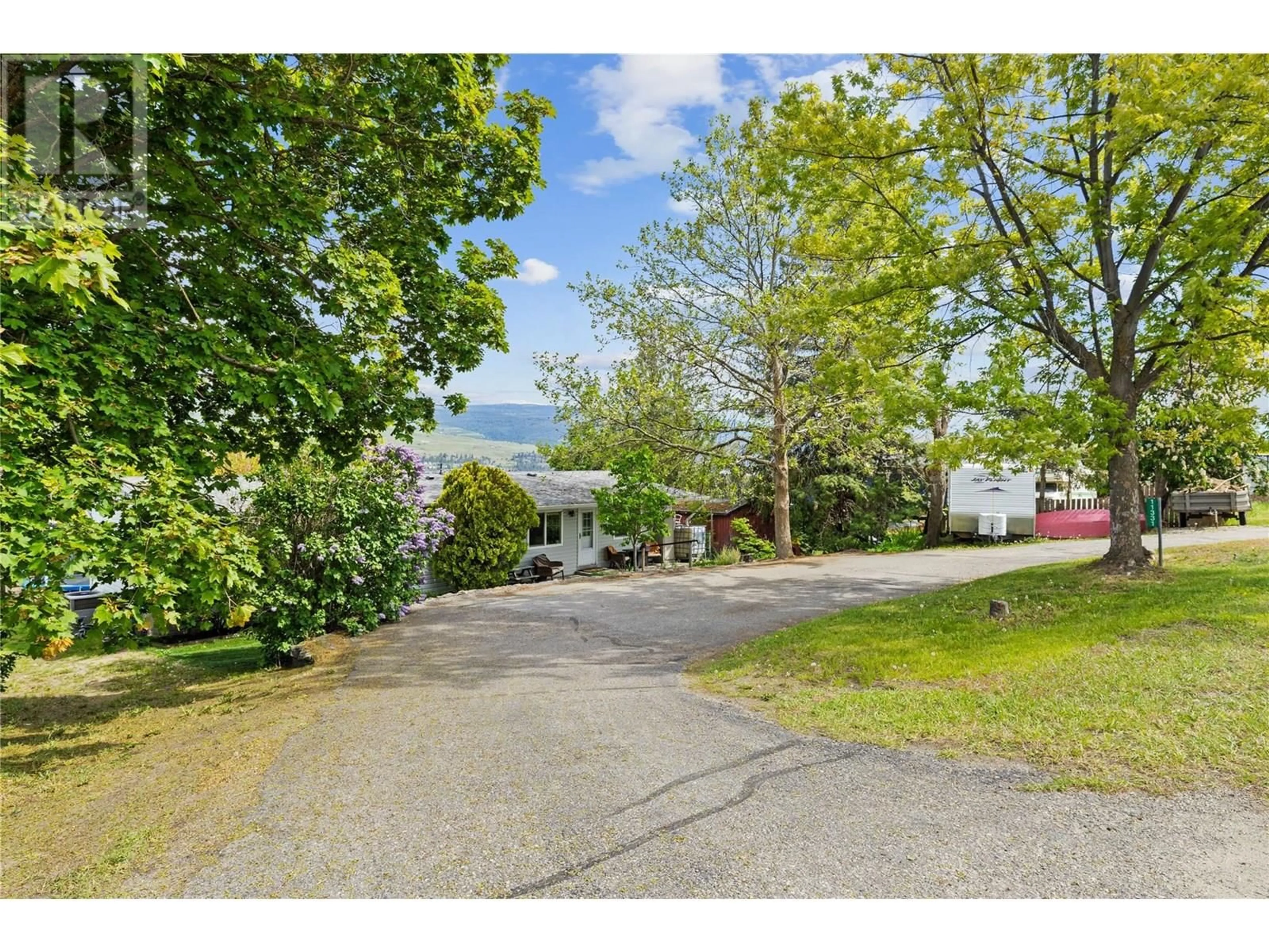A pic from outside/outdoor area/front of a property/back of a property/a pic from drone, street for 11331 BOND ROAD, Lake Country British Columbia V4V1J5