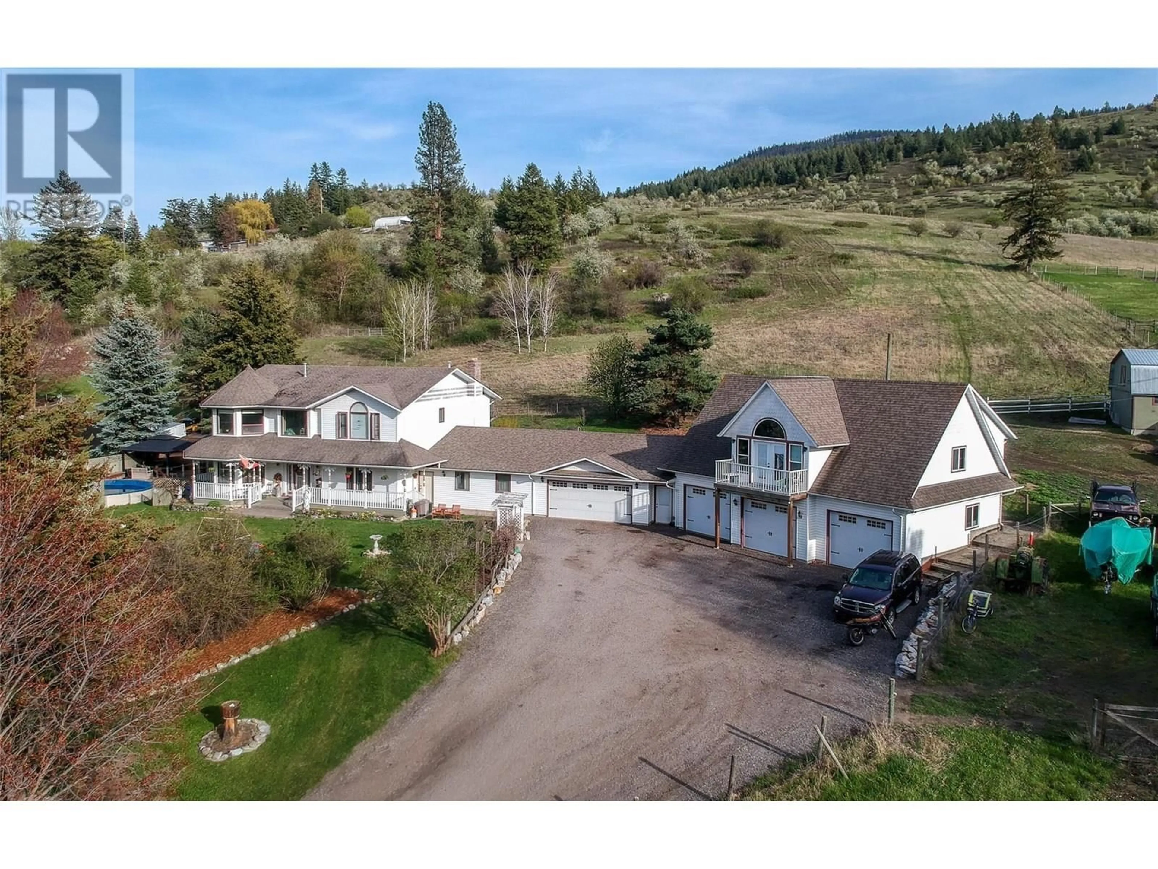 A pic from outside/outdoor area/front of a property/back of a property/a pic from drone, mountain view for 6655 COSENS BAY ROAD, Coldstream British Columbia V1B1N7