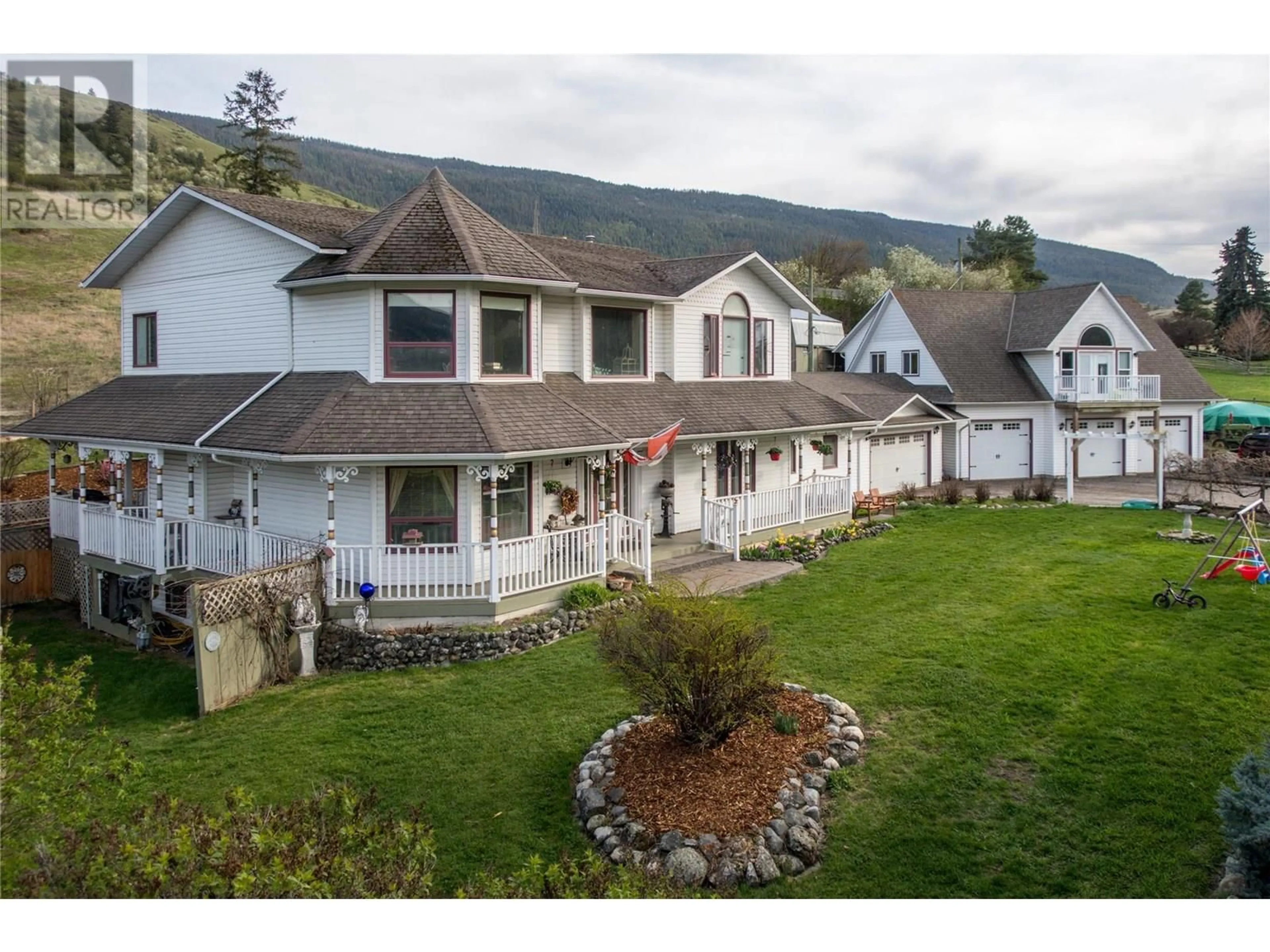 A pic from outside/outdoor area/front of a property/back of a property/a pic from drone, mountain view for 6655 COSENS BAY ROAD, Coldstream British Columbia V1B1N7