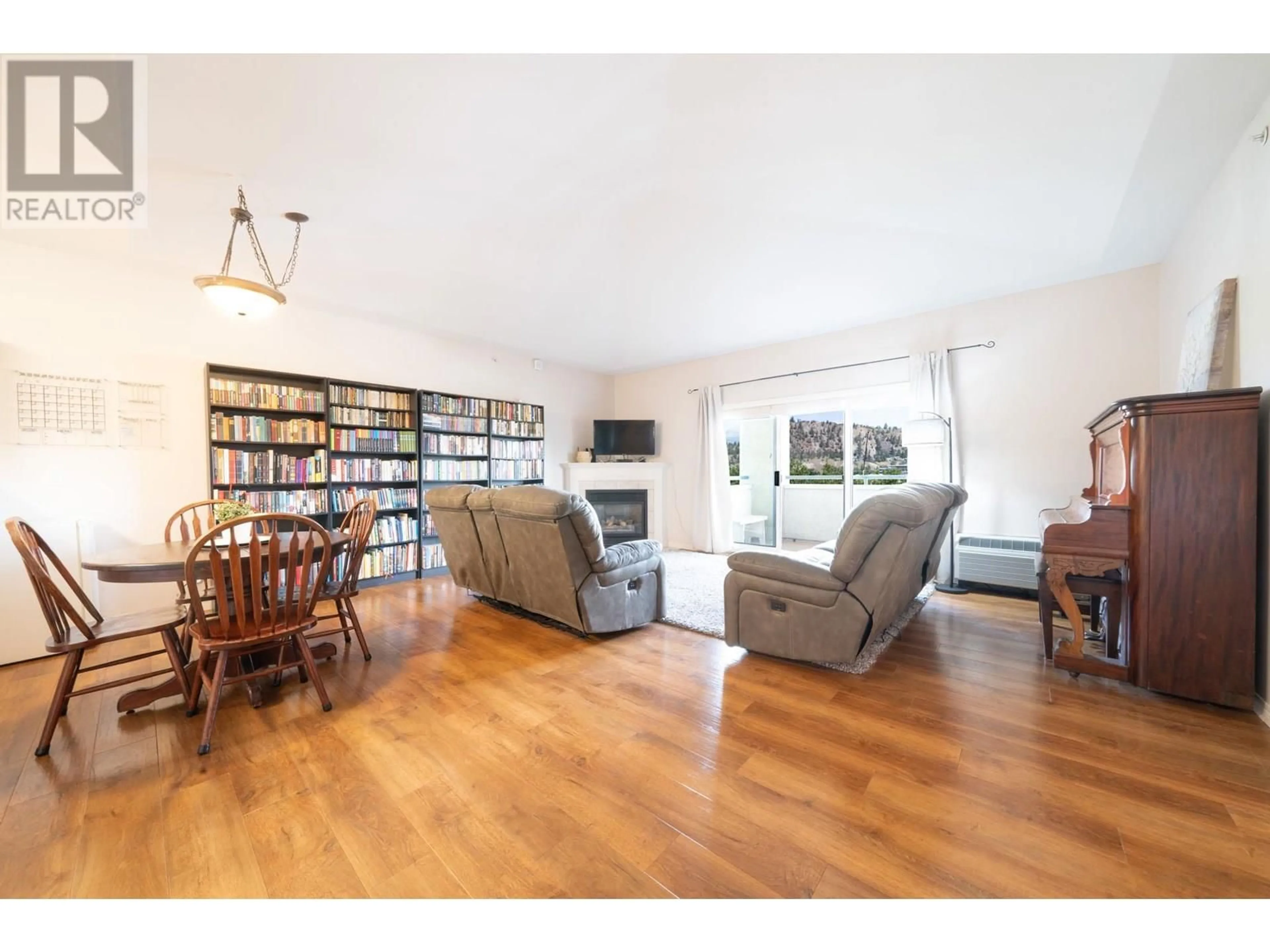 Living room with furniture, wood/laminate floor for 405 - 1950 DURNIN ROAD, Kelowna British Columbia V1X7W6