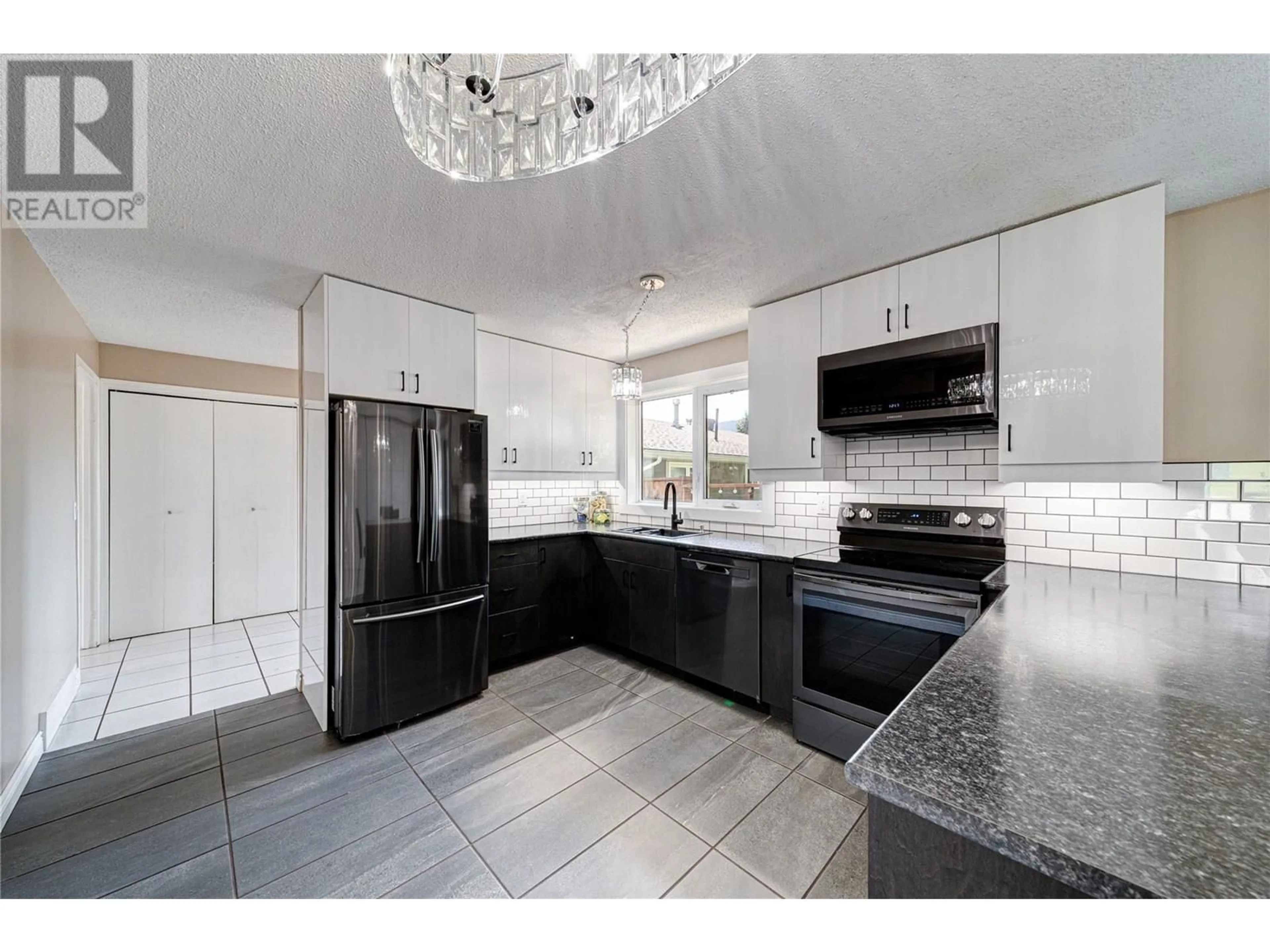 Open concept kitchen, ceramic/tile floor for 1255 HICKORY CRESCENT, Sparwood British Columbia V0B2G2