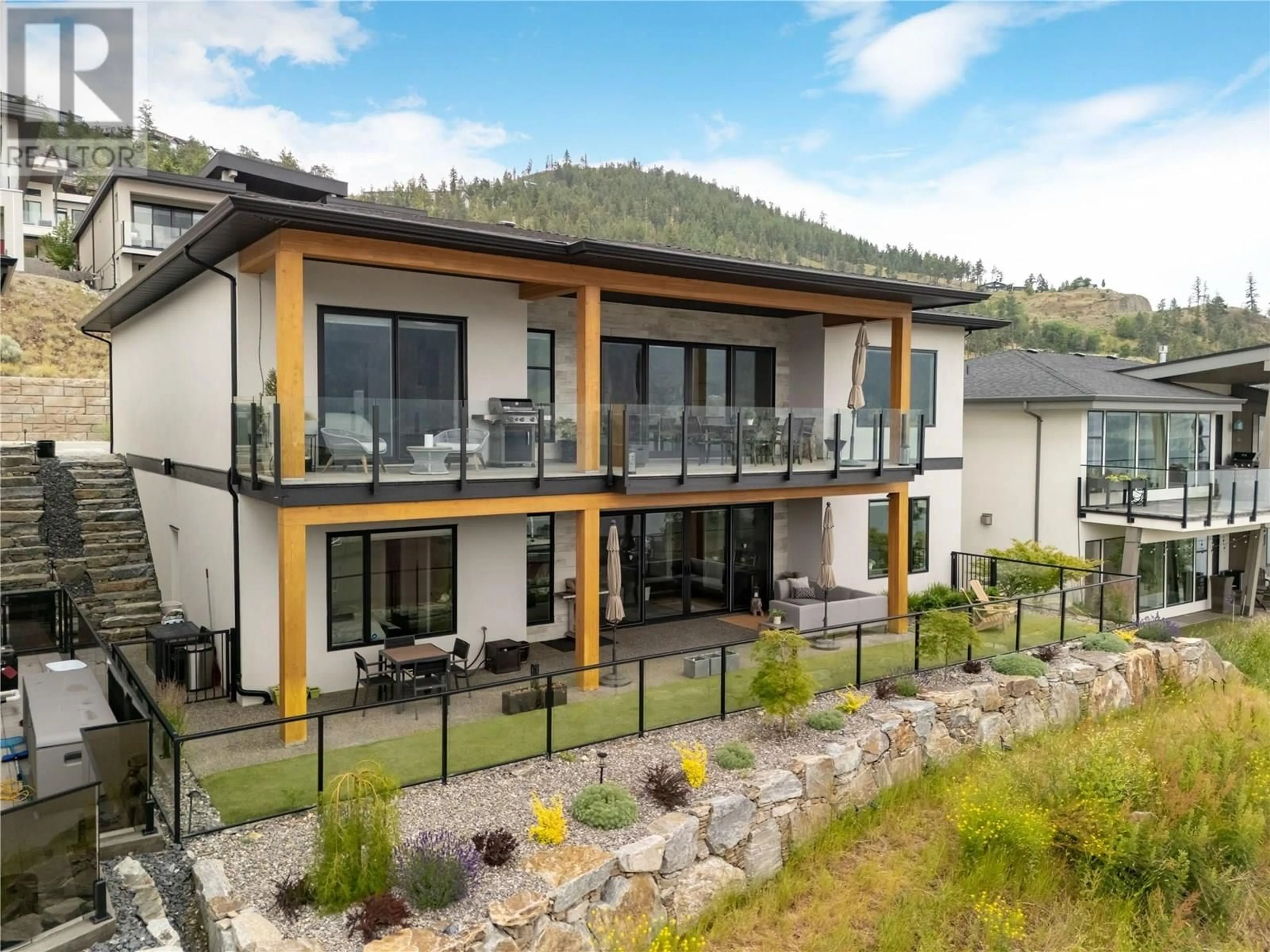 A pic from outside/outdoor area/front of a property/back of a property/a pic from drone, mountain view for 3450 CHOCOLATE LILY LANE, Kelowna British Columbia V1V3G2