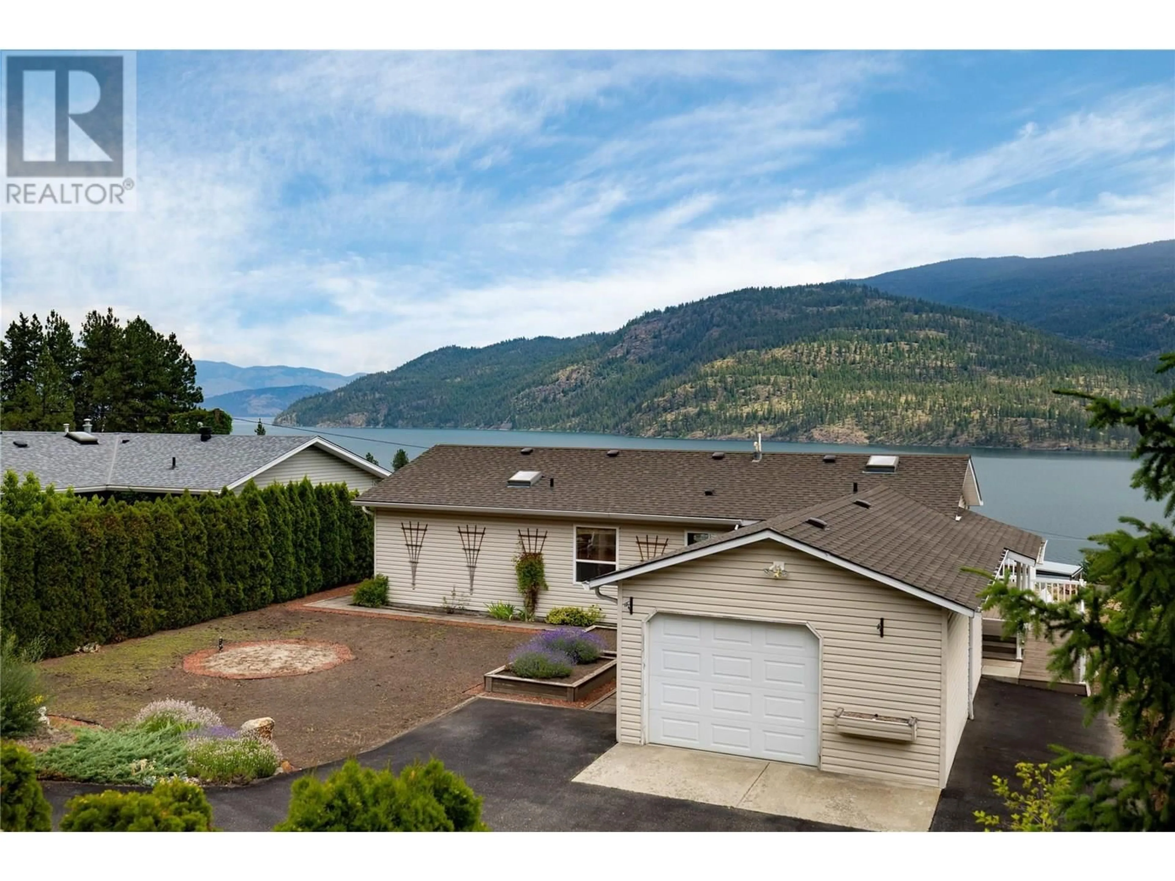 A pic from outside/outdoor area/front of a property/back of a property/a pic from drone, water/lake/river/ocean view for 17610  41 RAWSTHORNE ROAD, Lake Country British Columbia V4V2G1