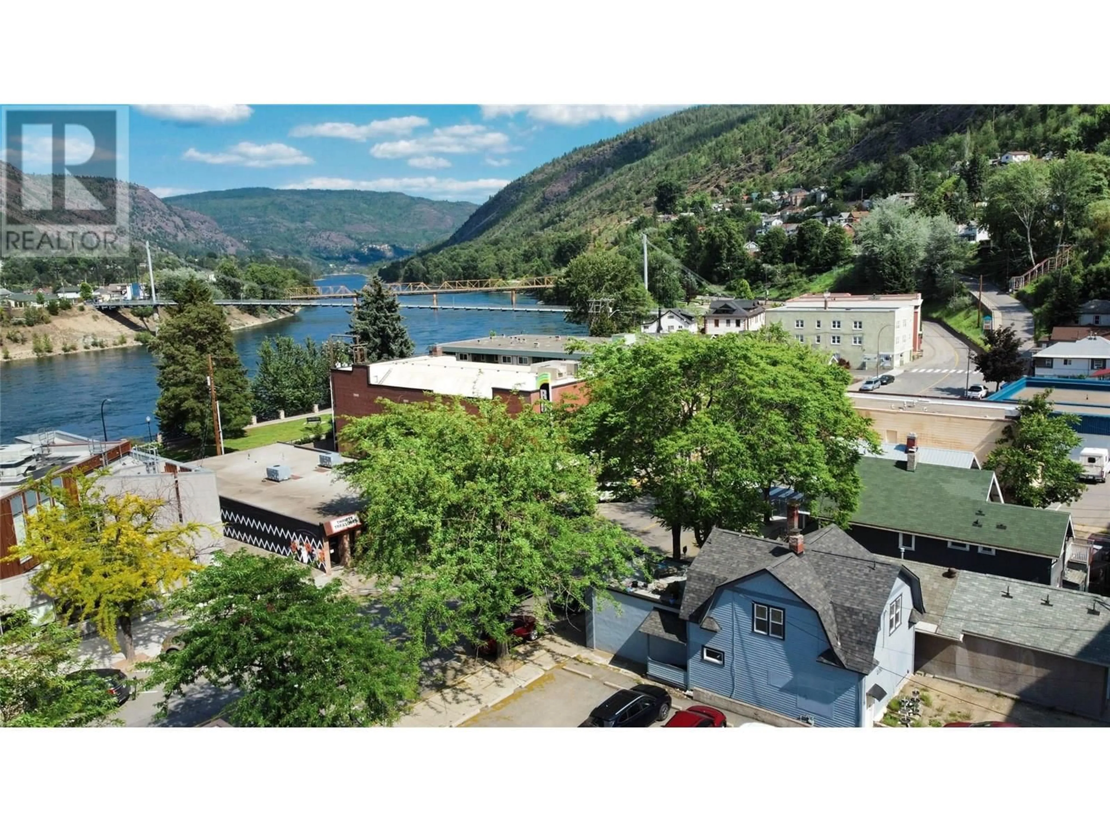 A pic from outside/outdoor area/front of a property/back of a property/a pic from drone, mountain view for 1560 BAY AVENUE, Trail British Columbia V1R4B3