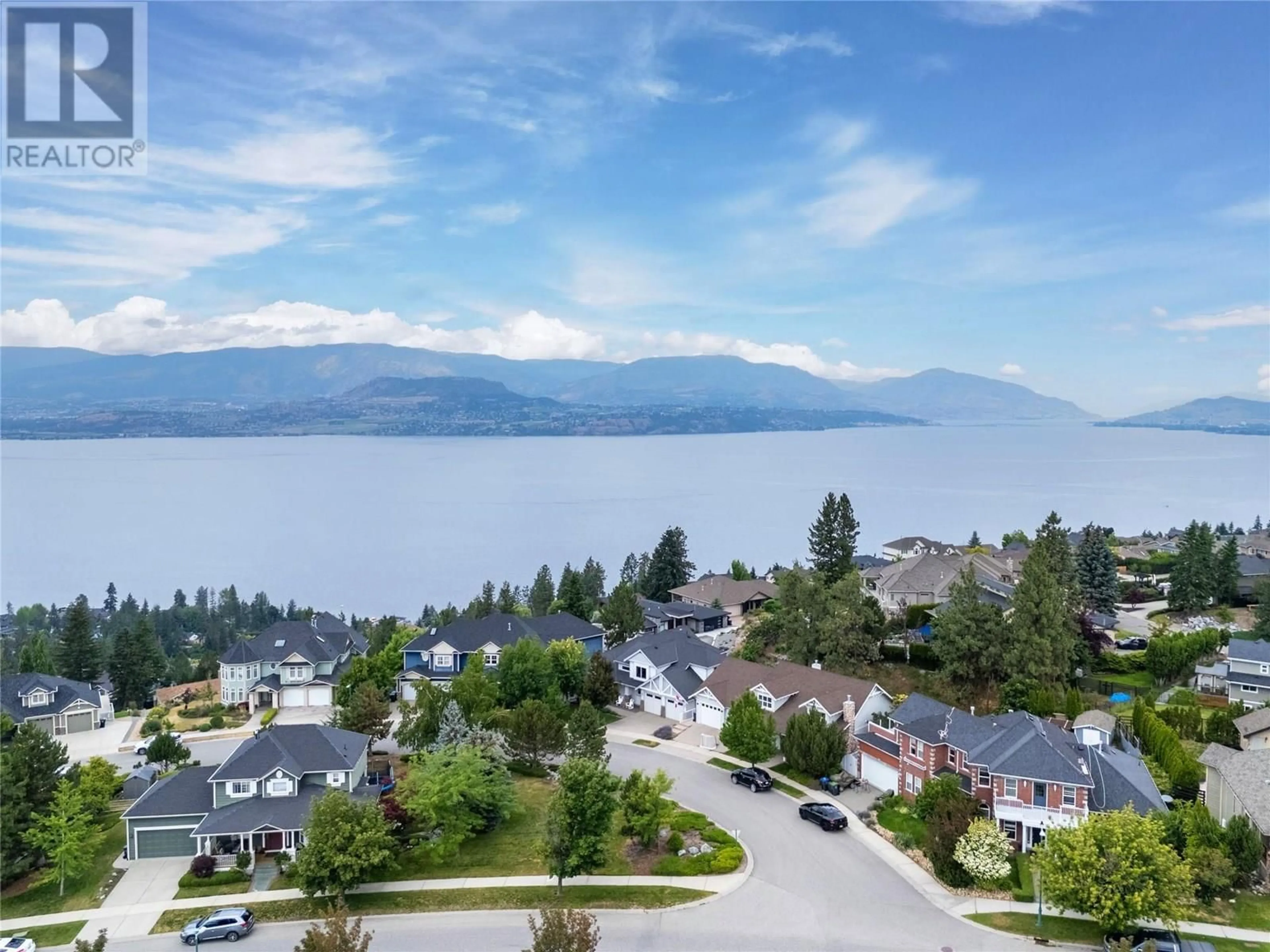 A pic from outside/outdoor area/front of a property/back of a property/a pic from drone, water/lake/river/ocean view for 404 QUILCHENA CRESCENT, Kelowna British Columbia V1W4W4
