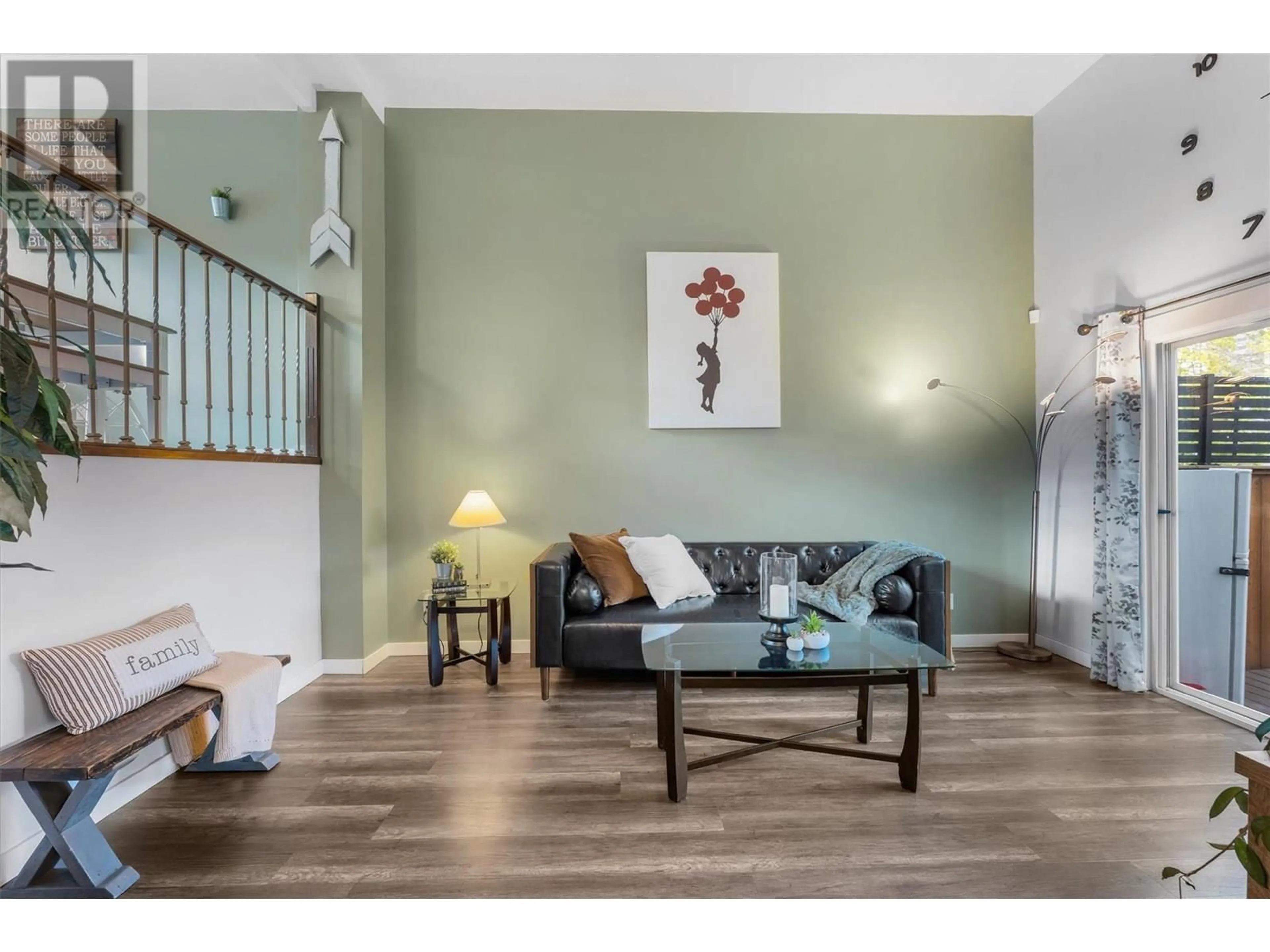 Living room with furniture, wood/laminate floor for 9 - 1985 BURTCH ROAD, Kelowna British Columbia V1Y4B4