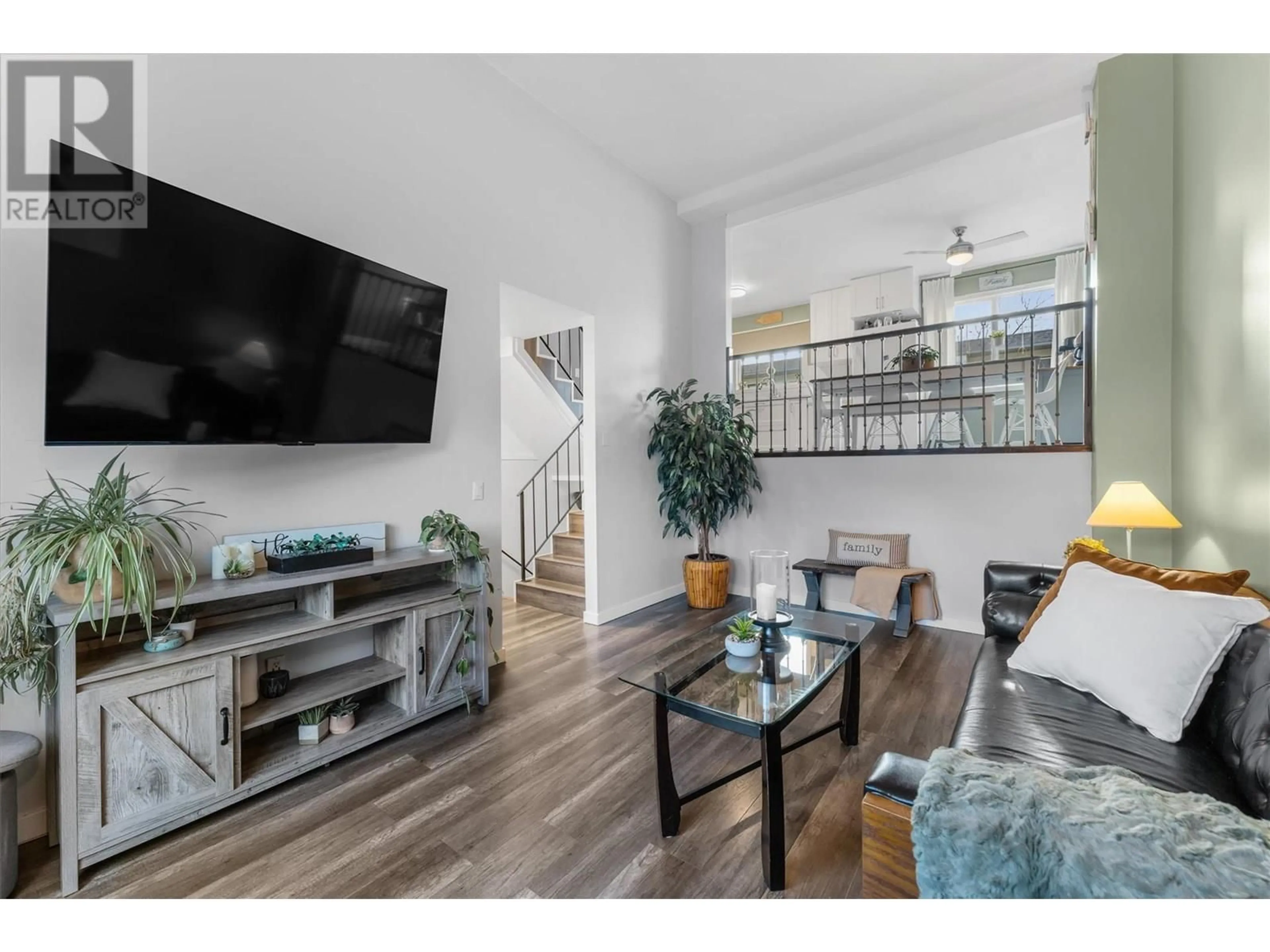 Living room with furniture, wood/laminate floor for 9 - 1985 BURTCH ROAD, Kelowna British Columbia V1Y4B4