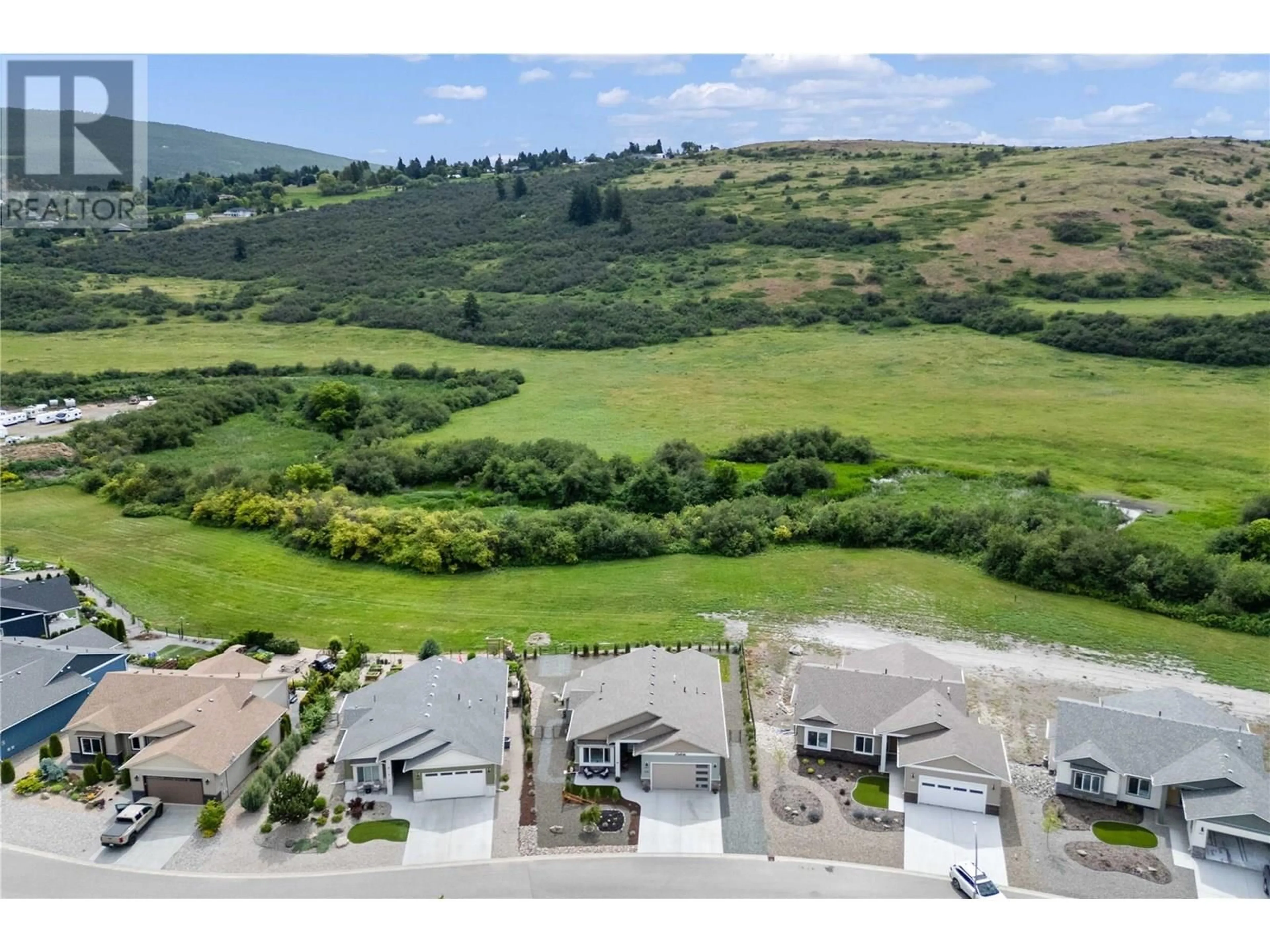A pic from outside/outdoor area/front of a property/back of a property/a pic from drone, mountain view for 457 4 STREET, Vernon British Columbia V1H1Z1