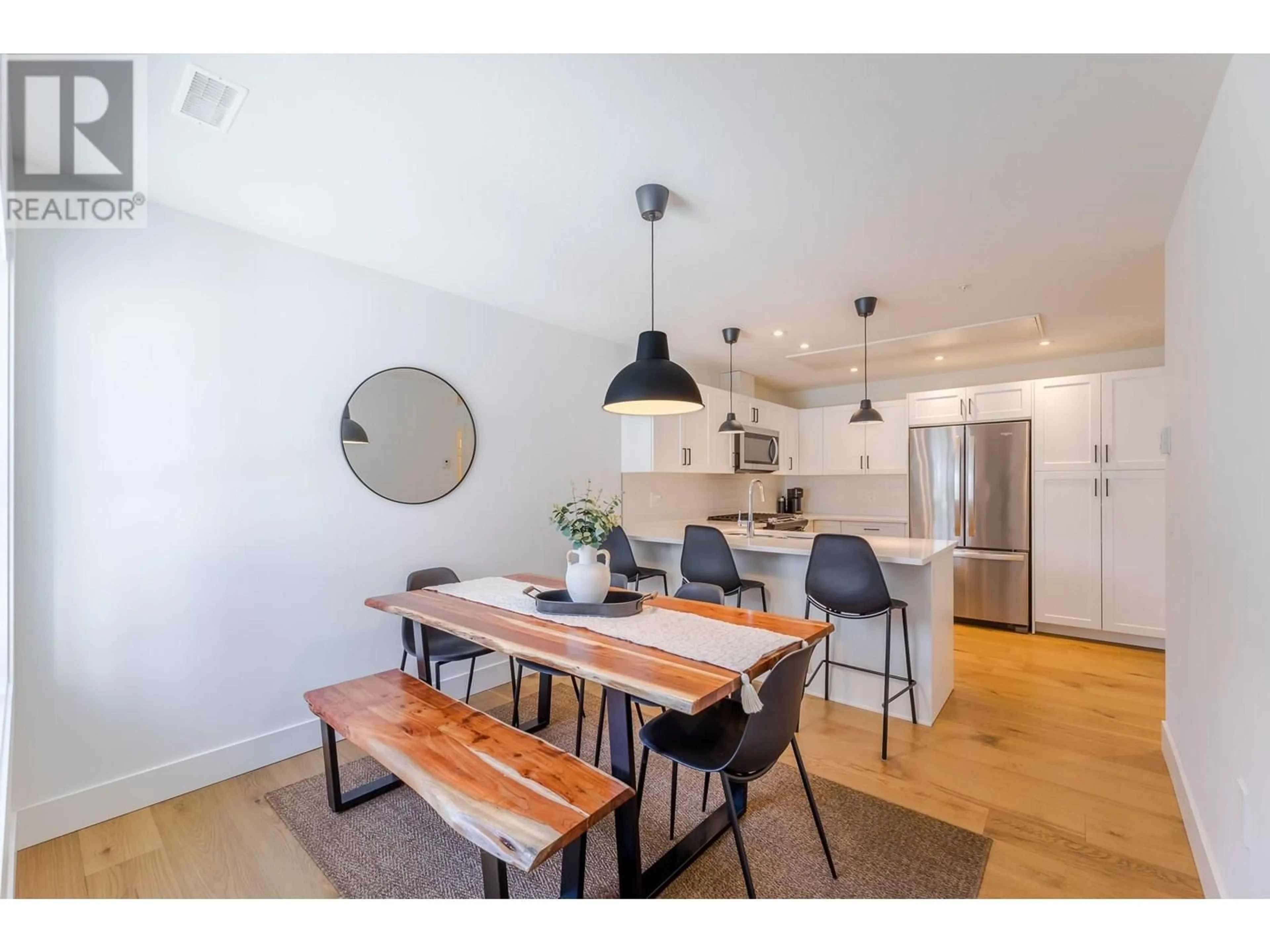Open concept kitchen, wood/laminate floor for 110 - 3362 SKAHA LAKE ROAD, Penticton British Columbia V2A0J4