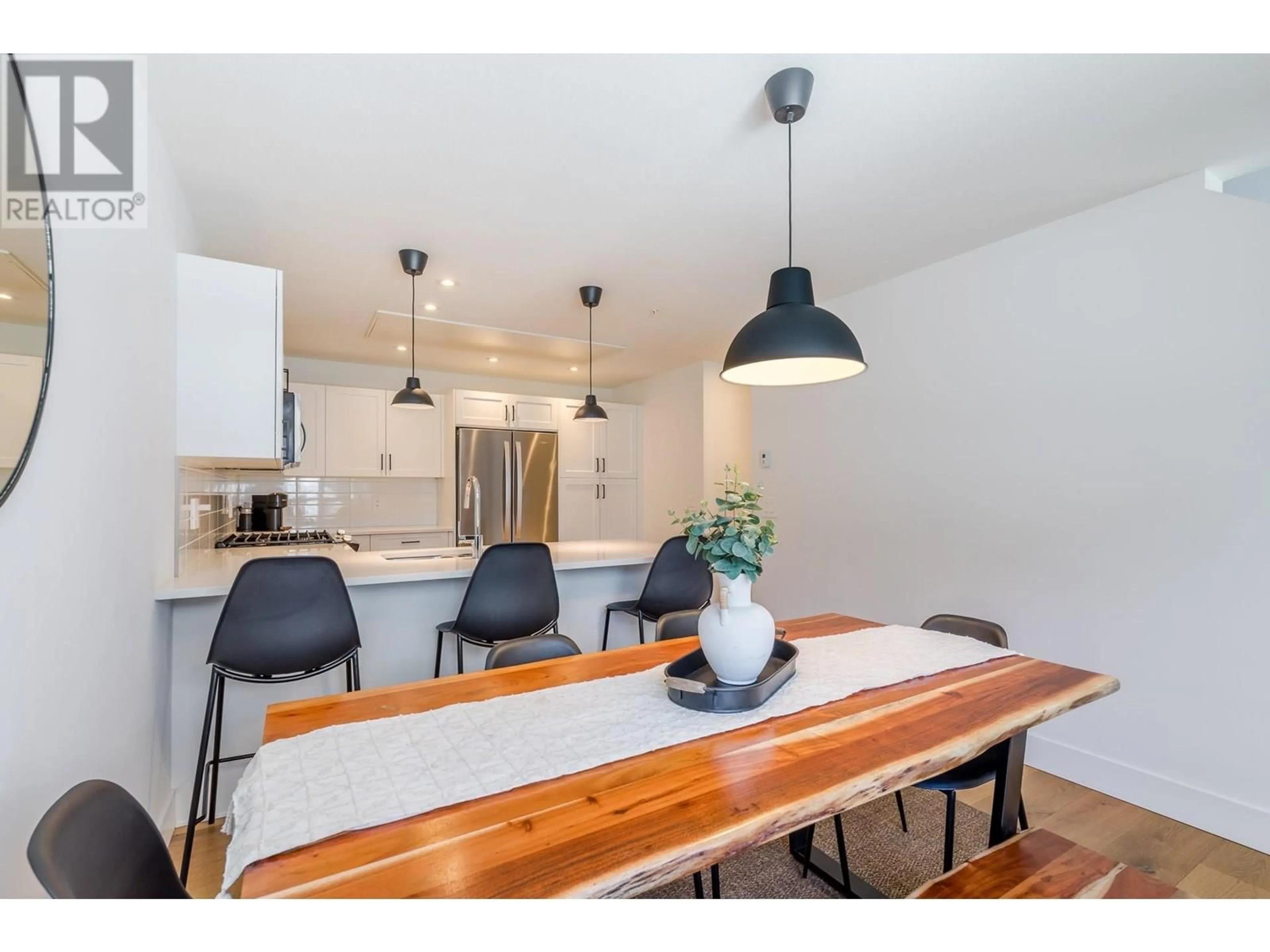 Open concept kitchen, wood/laminate floor for 110 - 3362 SKAHA LAKE ROAD, Penticton British Columbia V2A0J4