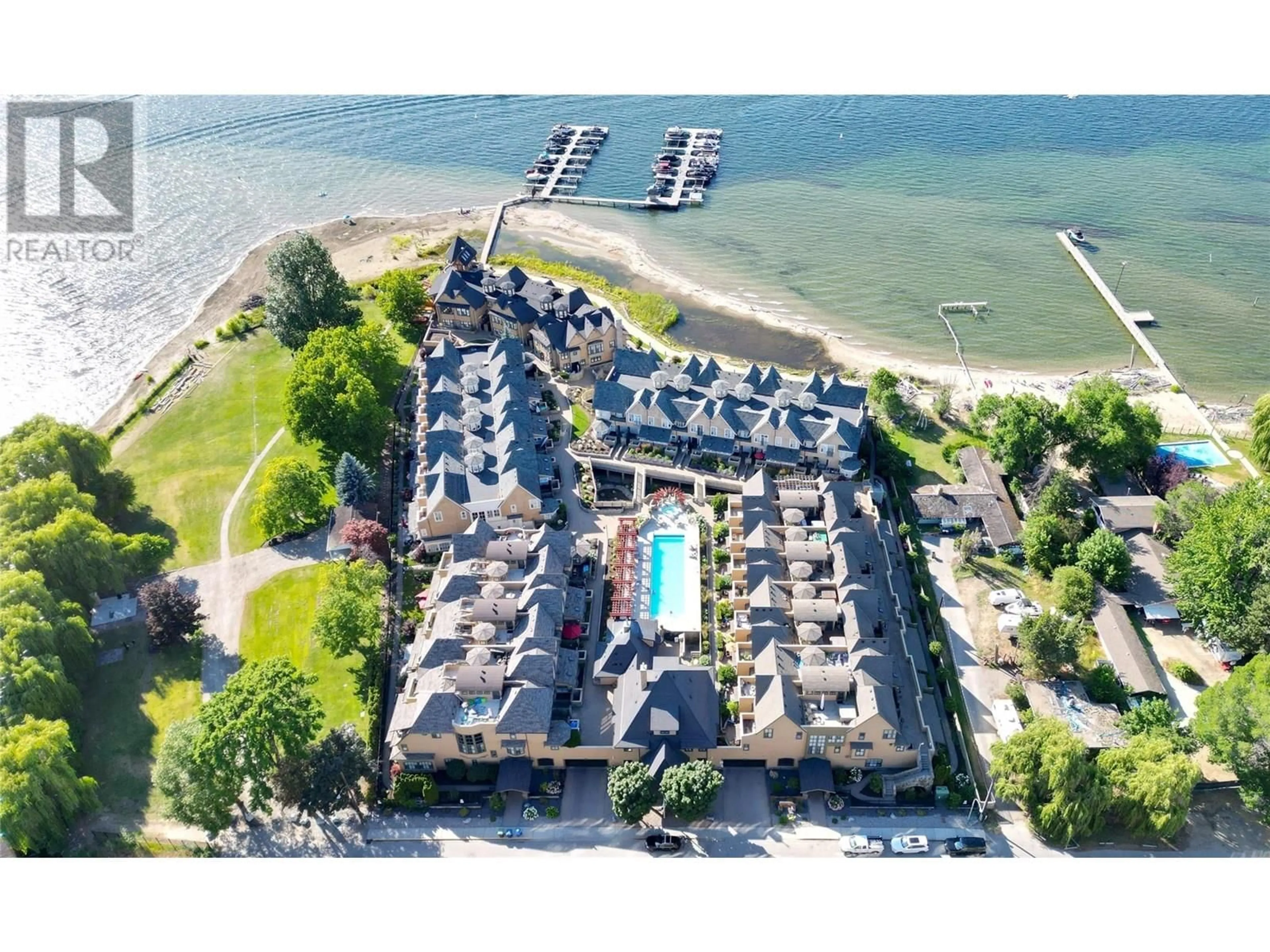 A pic from outside/outdoor area/front of a property/back of a property/a pic from drone, water/lake/river/ocean view for 427 - 3880 TRUSWELL ROAD, Kelowna British Columbia V1W5A2