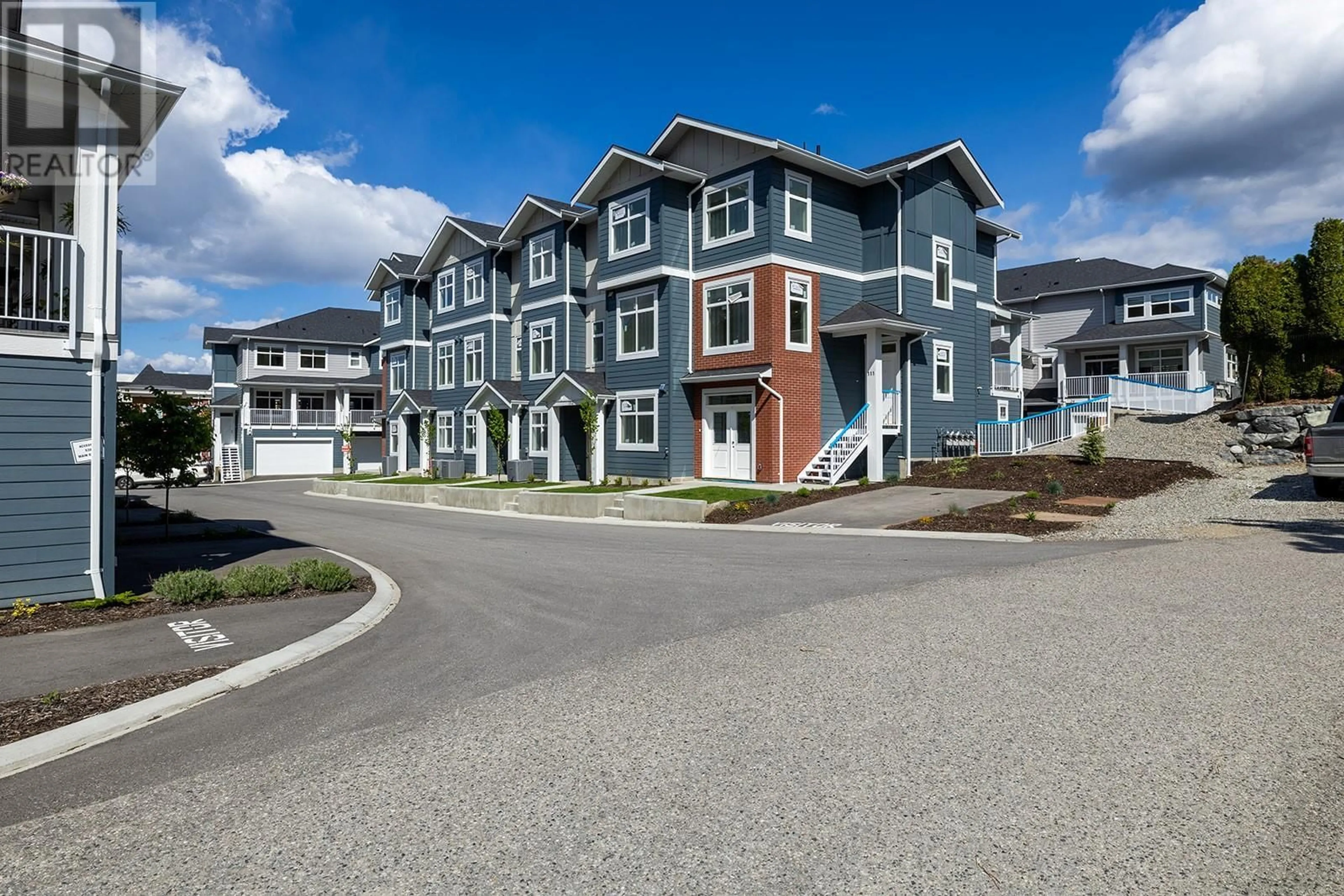 A pic from outside/outdoor area/front of a property/back of a property/a pic from drone, street for 112 - 5300 MAIN STREET, Kelowna British Columbia V1W0C1