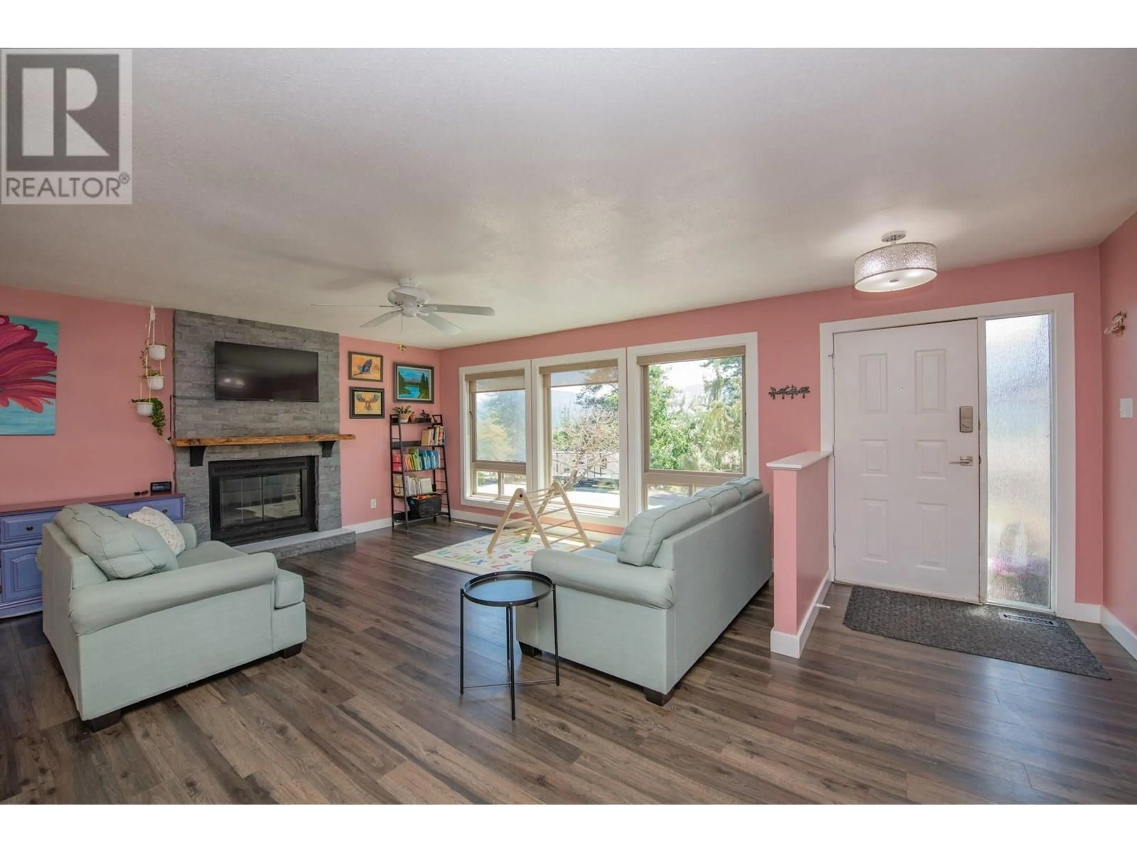 Living room with furniture, wood/laminate floor for 1908 SADDLEVIEW AVENUE, Lumby British Columbia V0E2G0