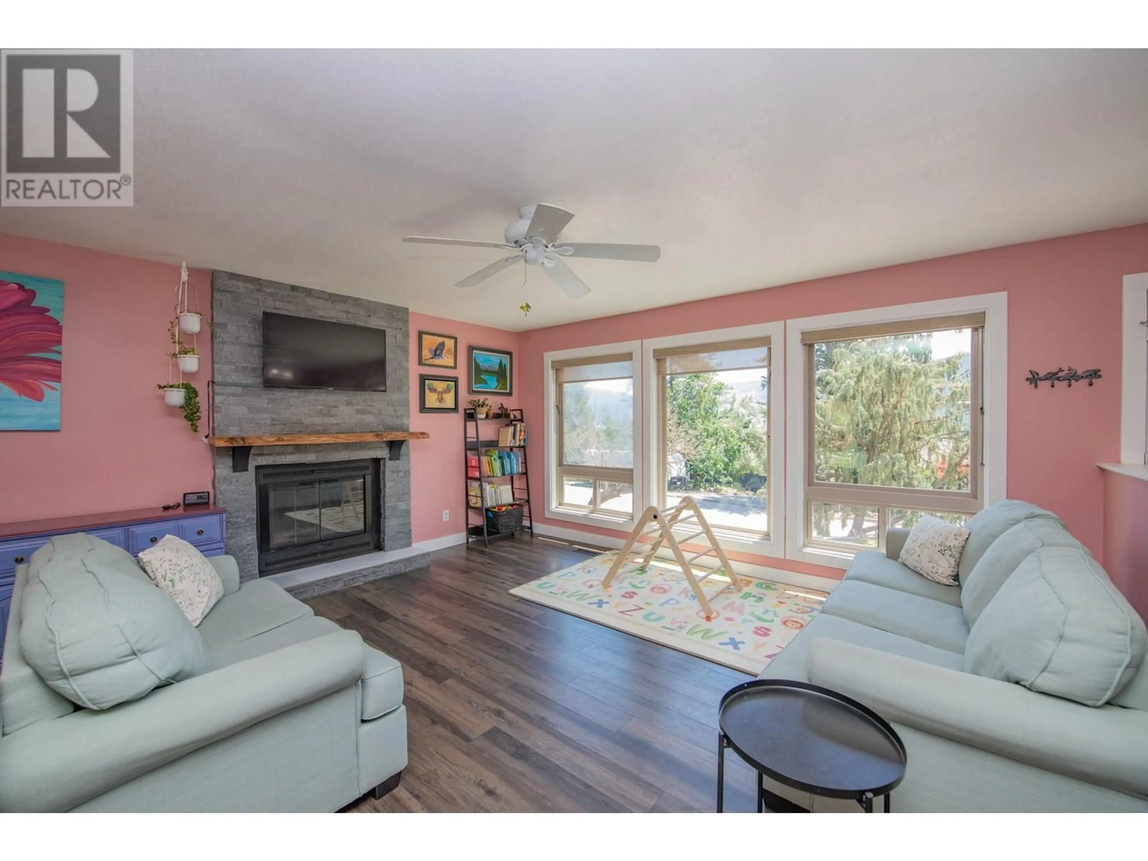 Living room with furniture, wood/laminate floor for 1908 SADDLEVIEW AVENUE, Lumby British Columbia V0E2G0