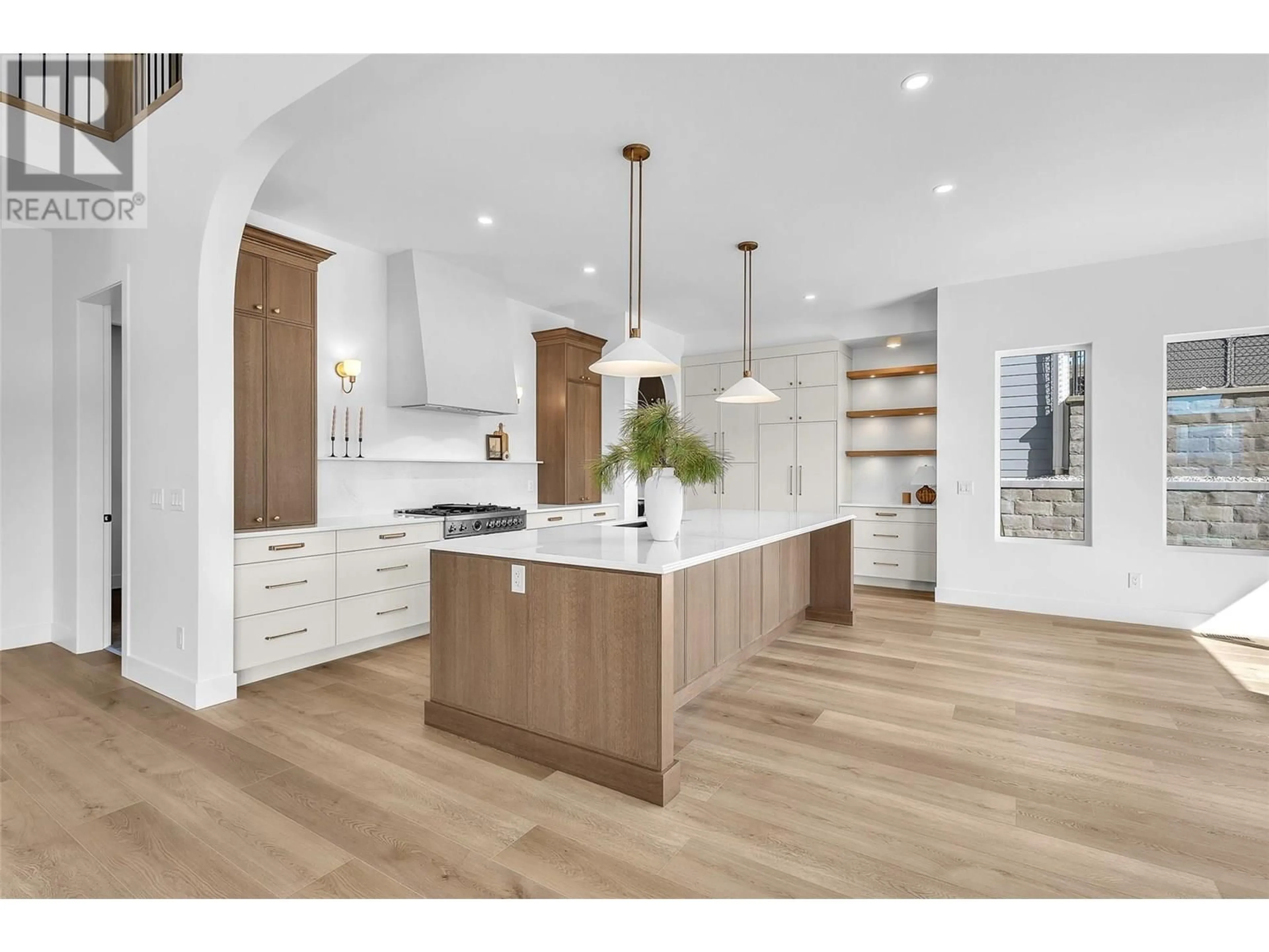 Open concept kitchen, wood/laminate floor for 1439 WHISTLING PINE PLACE, Kelowna British Columbia V1V2C6