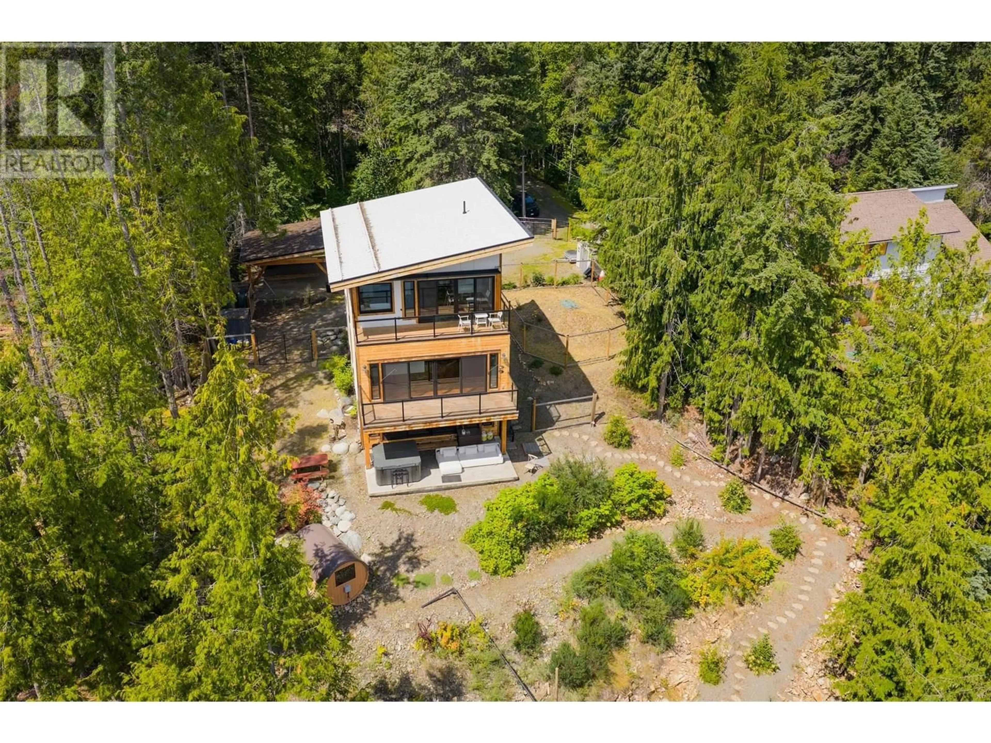 A pic from outside/outdoor area/front of a property/back of a property/a pic from drone, forest/trees view for 5336 AMUNDSEN ROAD, Kaslo British Columbia V0G1Y0