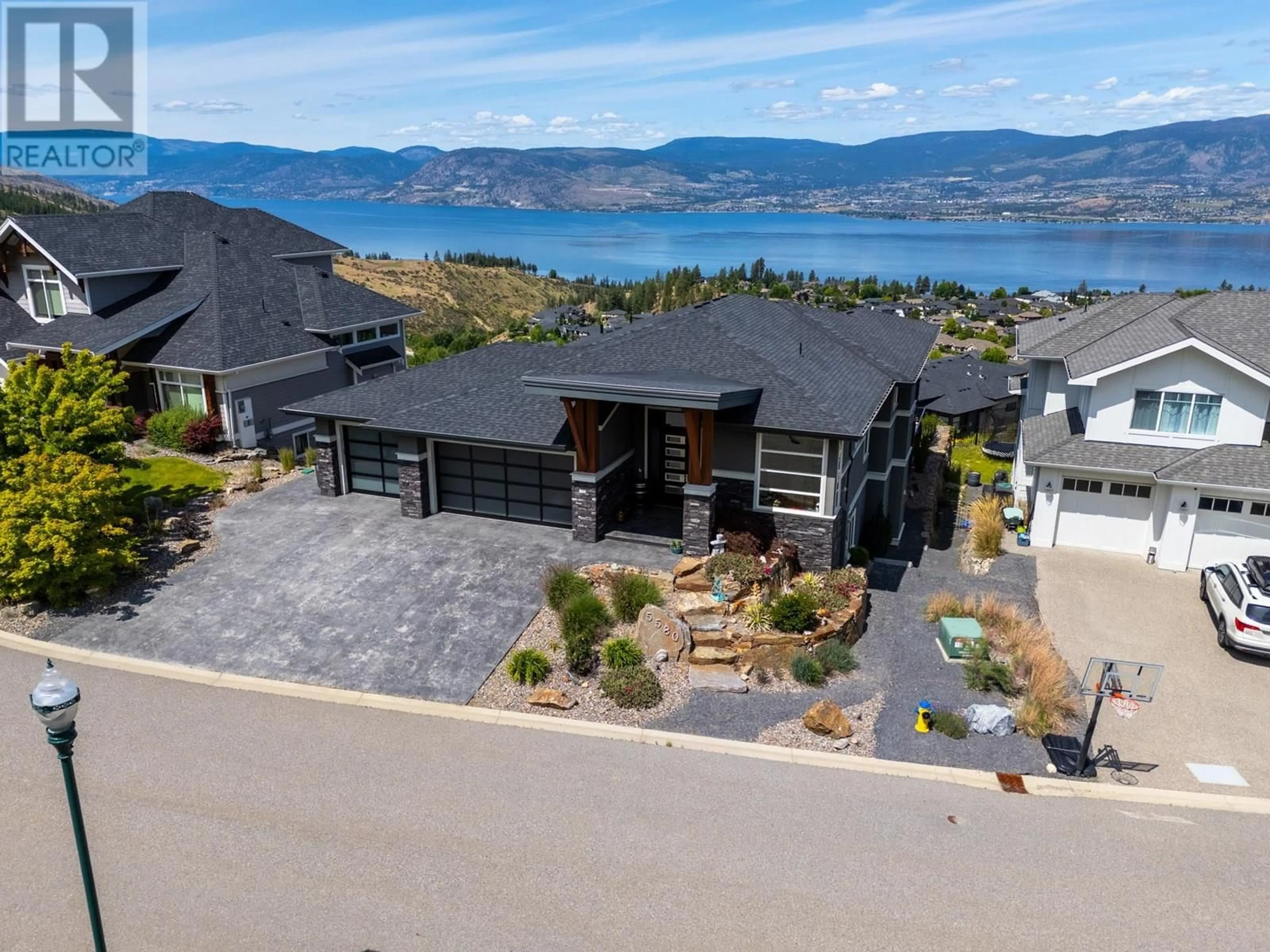 A pic from outside/outdoor area/front of a property/back of a property/a pic from drone, water/lake/river/ocean view for 5580 TRESTLE RIDGE COURT, Kelowna British Columbia V1W5M3