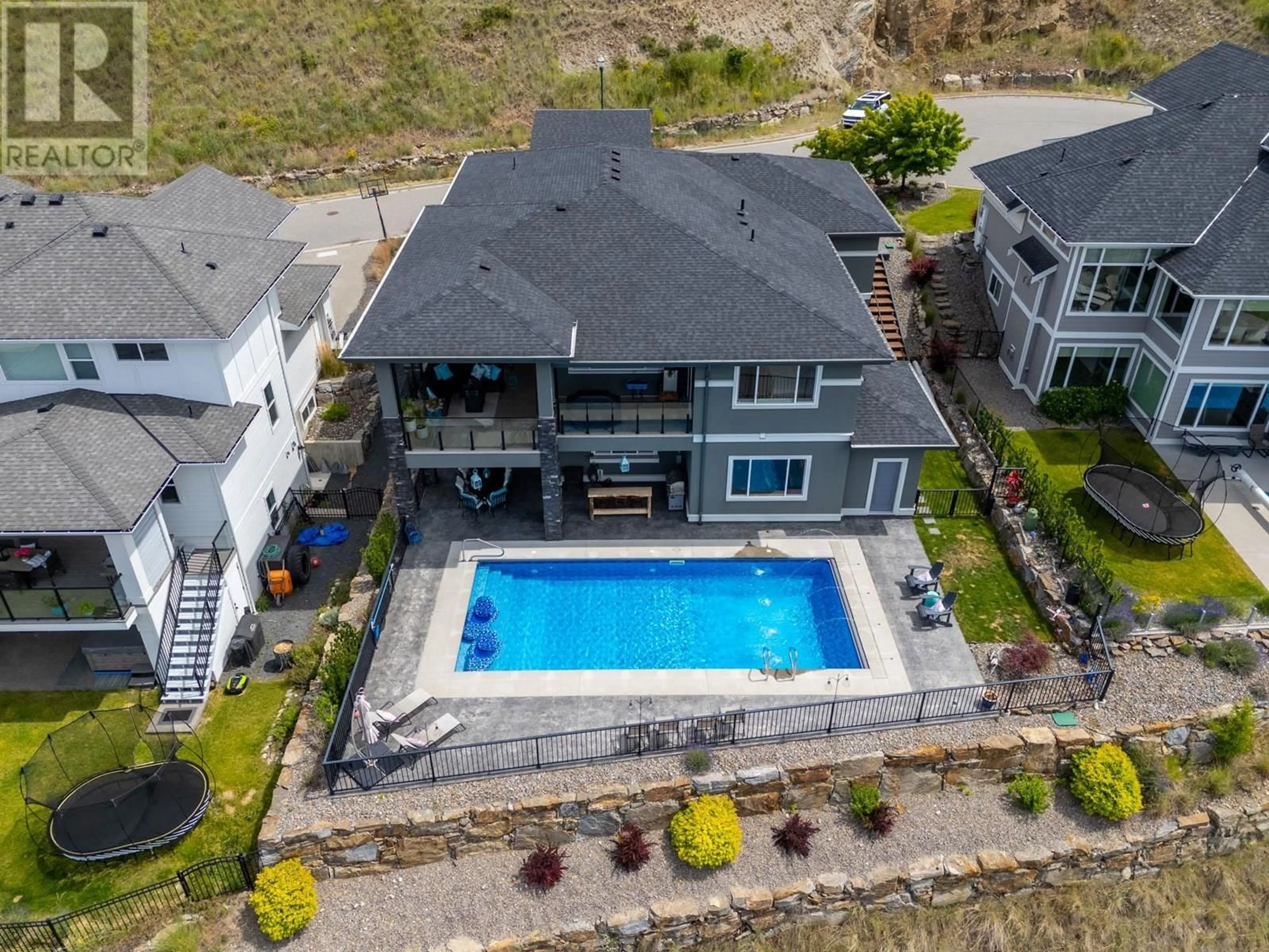 A pic from outside/outdoor area/front of a property/back of a property/a pic from drone, water/lake/river/ocean view for 5580 TRESTLE RIDGE COURT, Kelowna British Columbia V1W5M3