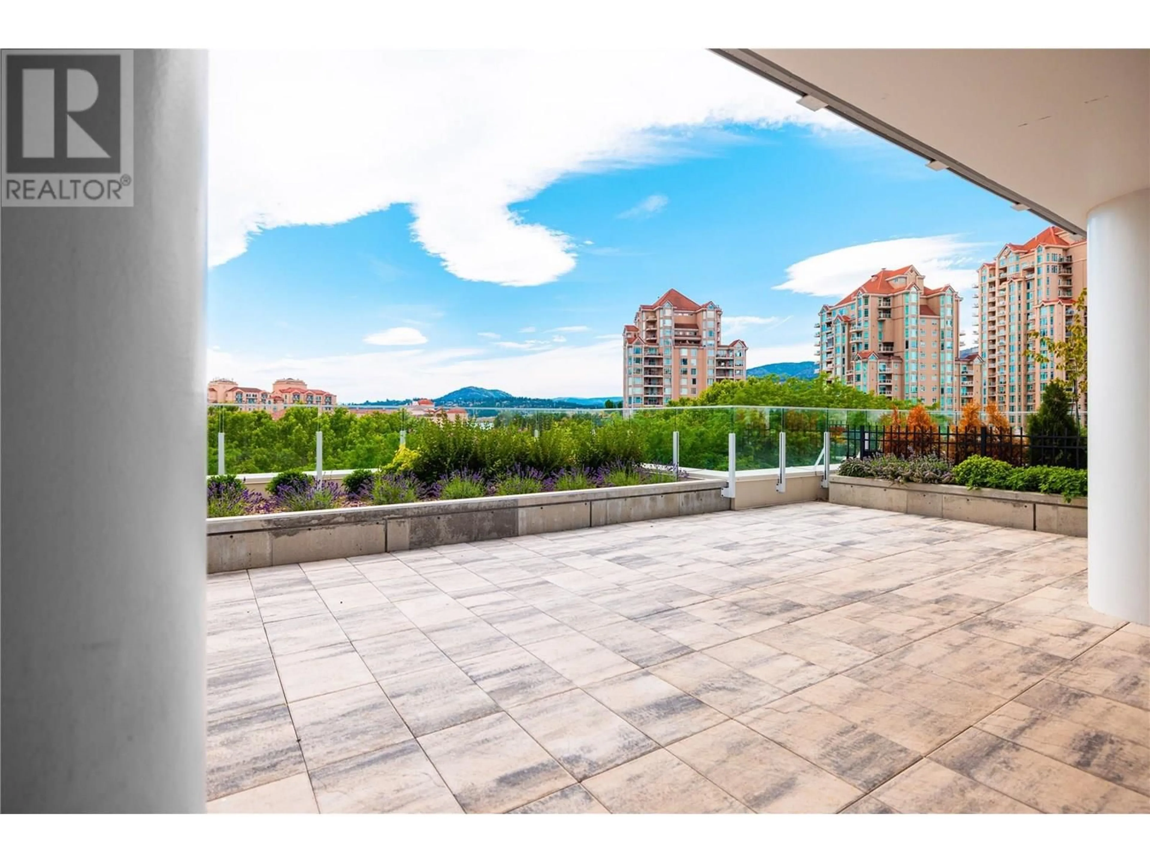 Patio, city buildings view from balcony for 402 - 1181 SUNSET DRIVE, Kelowna British Columbia V1Y0L4