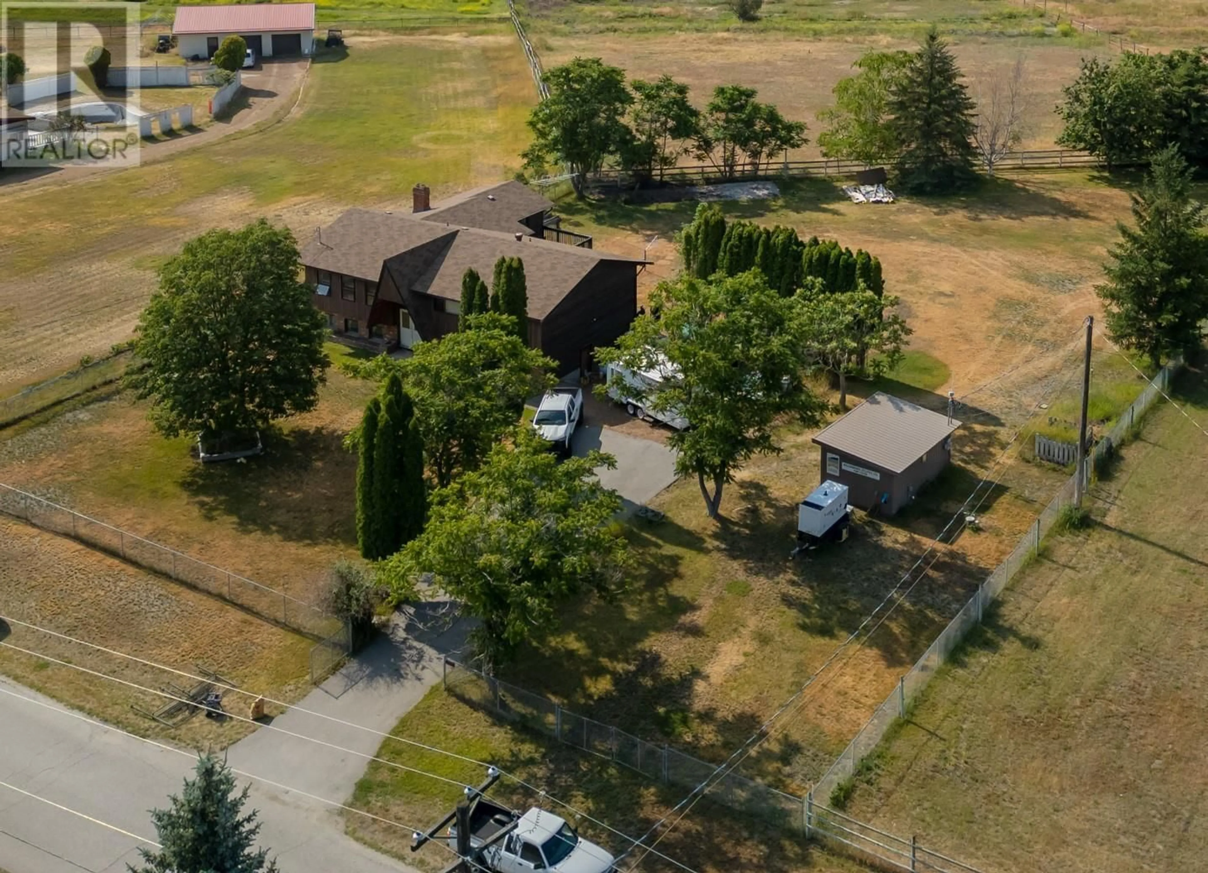A pic from outside/outdoor area/front of a property/back of a property/a pic from drone, street for 181 CARR CRESCENT, Oliver British Columbia V0H1T5
