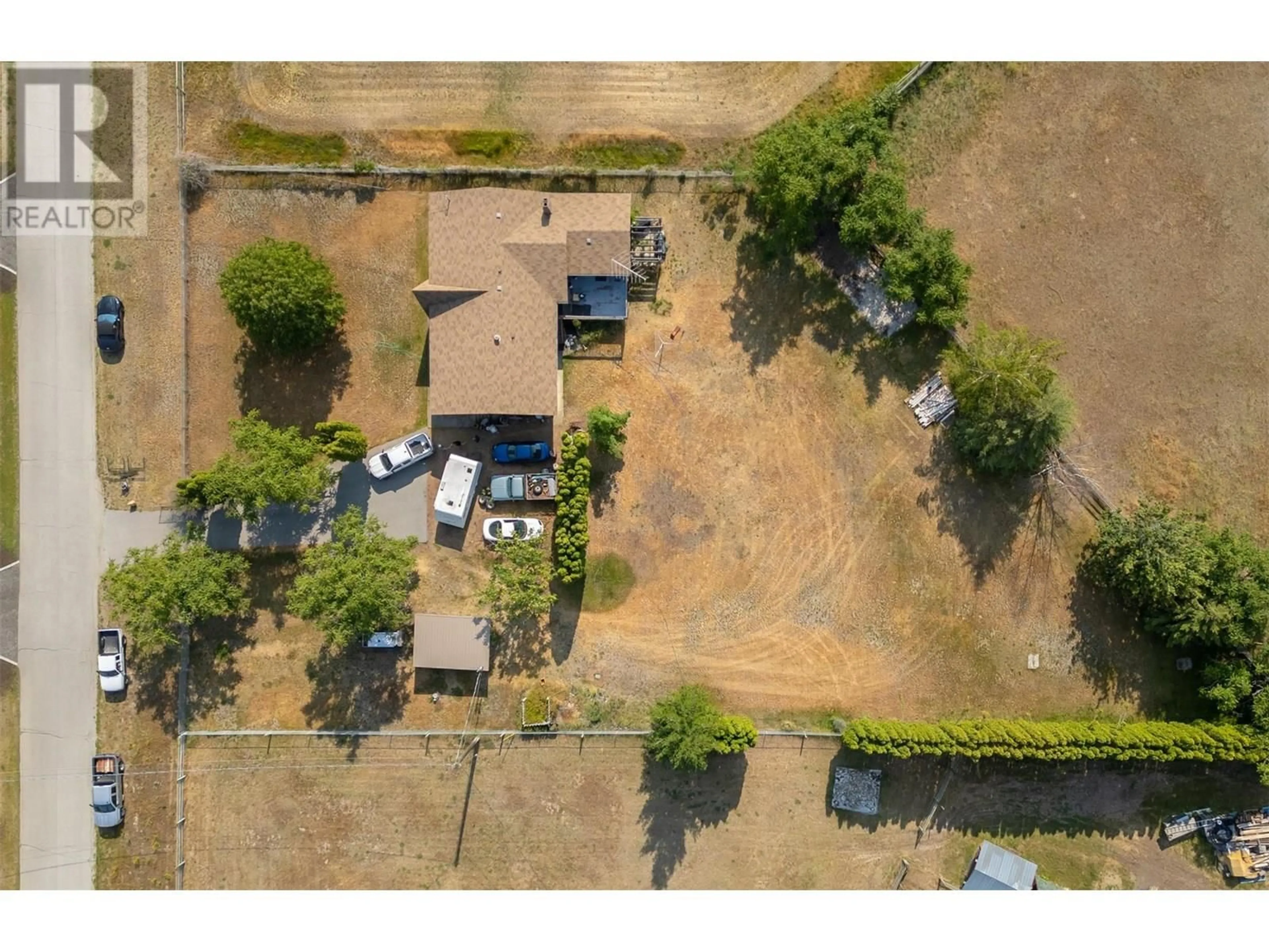 A pic from outside/outdoor area/front of a property/back of a property/a pic from drone, street for 181 CARR CRESCENT, Oliver British Columbia V0H1T5