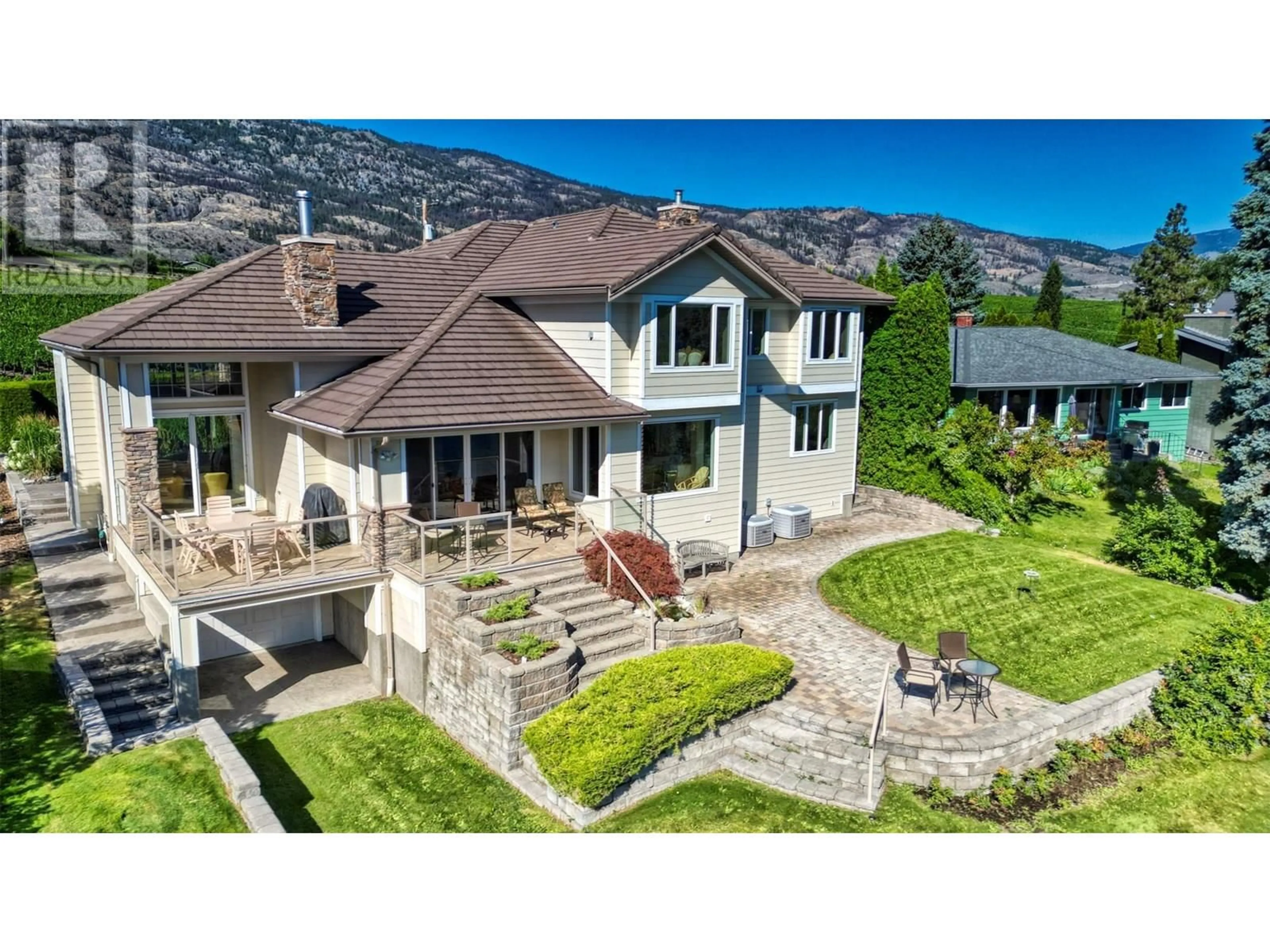 A pic from outside/outdoor area/front of a property/back of a property/a pic from drone, mountain view for 10411 81ST STREET, Osoyoos British Columbia V0H1V2