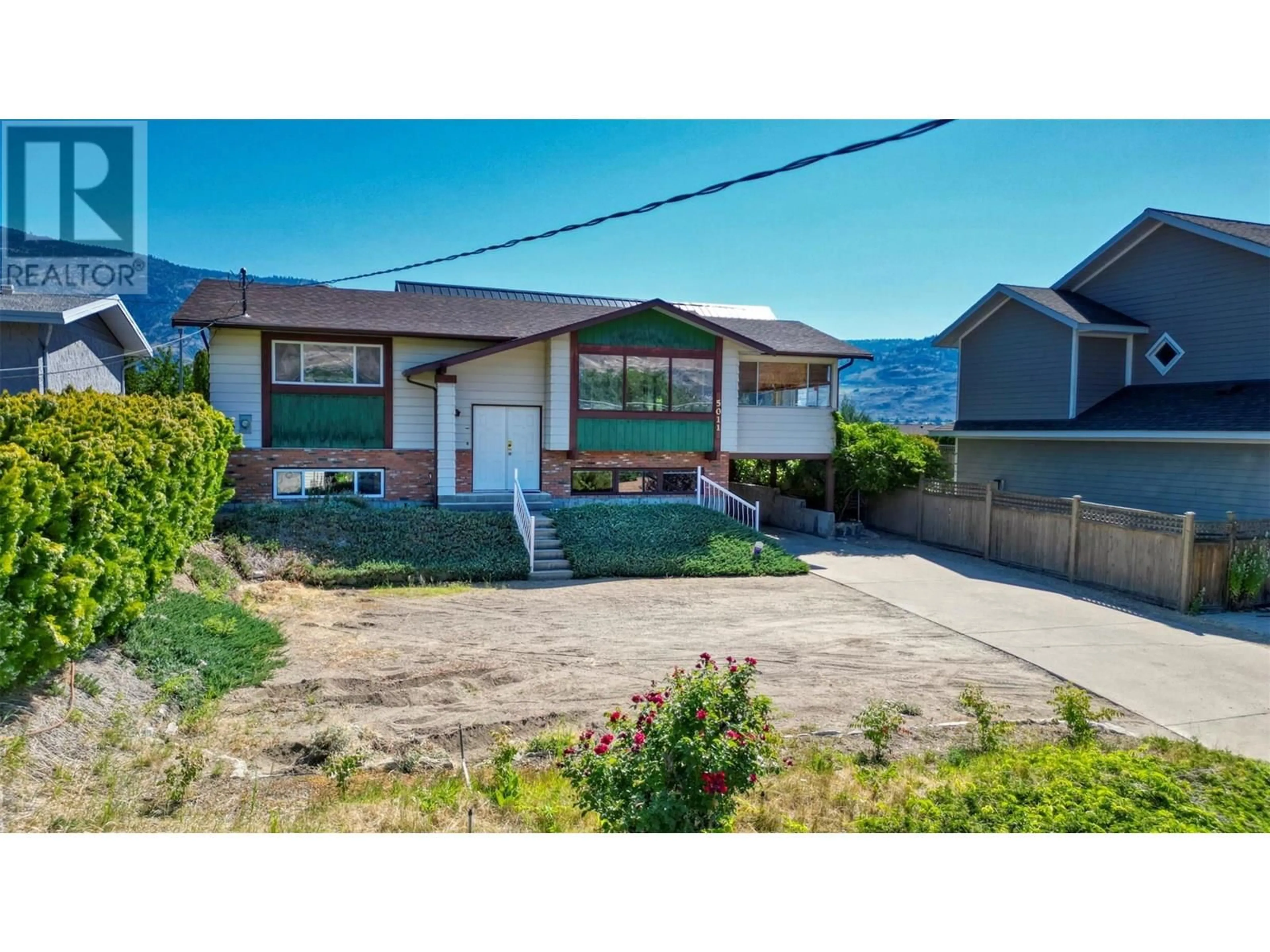 A pic from outside/outdoor area/front of a property/back of a property/a pic from drone, street for 5011 89TH STREET, Osoyoos British Columbia V0H1V2