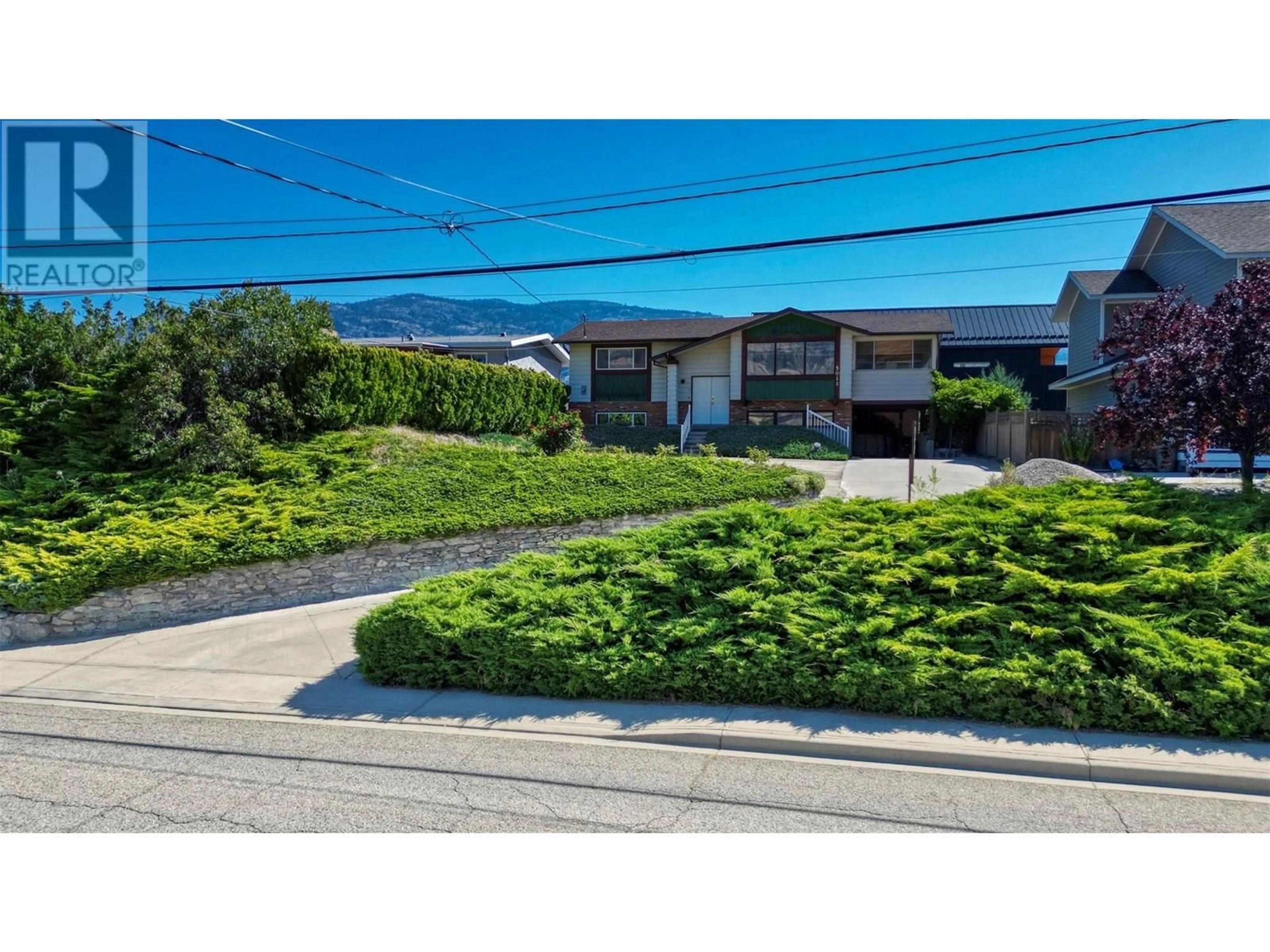 A pic from outside/outdoor area/front of a property/back of a property/a pic from drone, street for 5011 89TH STREET, Osoyoos British Columbia V0H1V2
