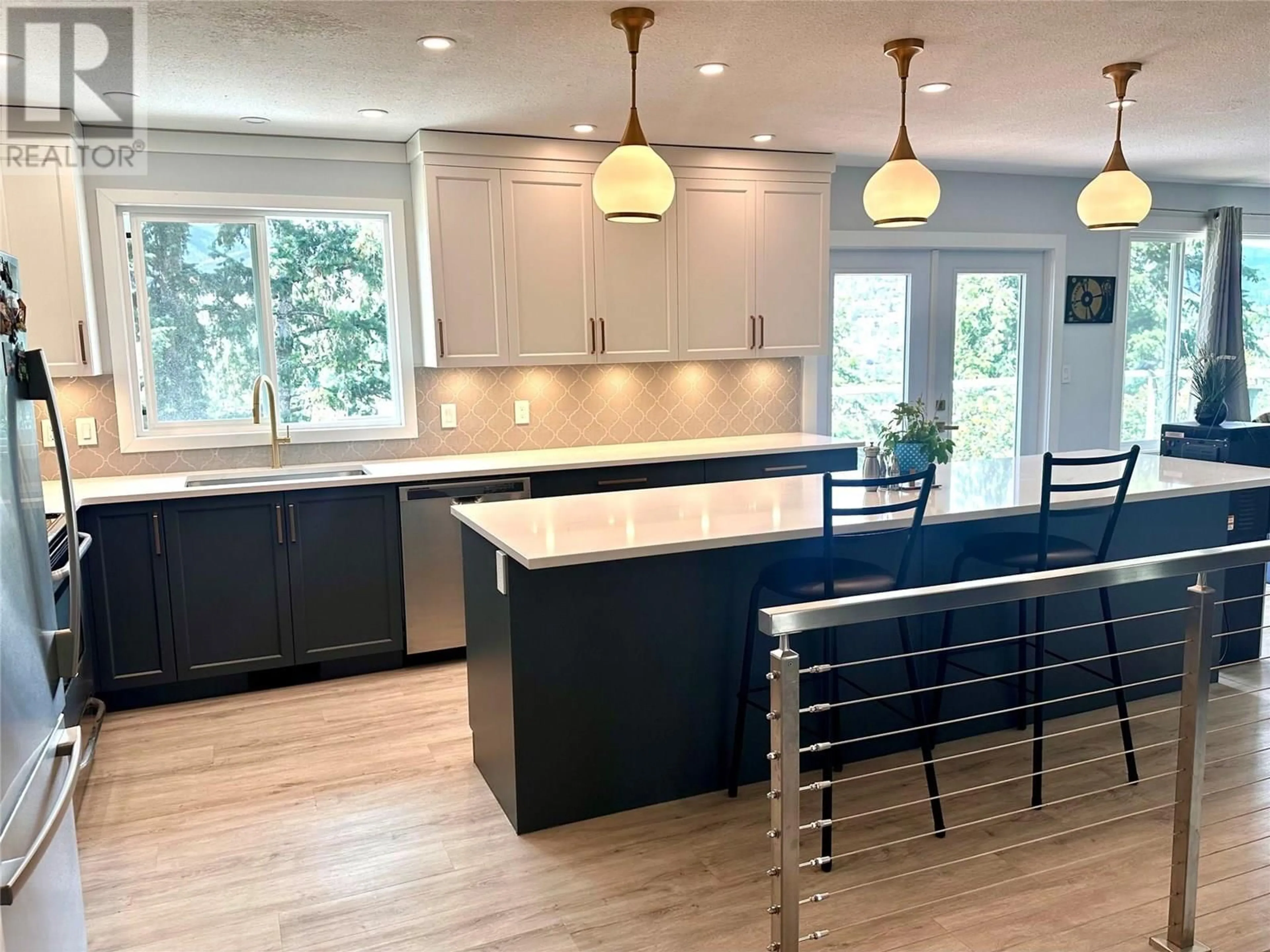 Open concept kitchen, wood/laminate floor for 2420 BOUCHERIE ROAD, West Kelowna British Columbia V1Z2E6